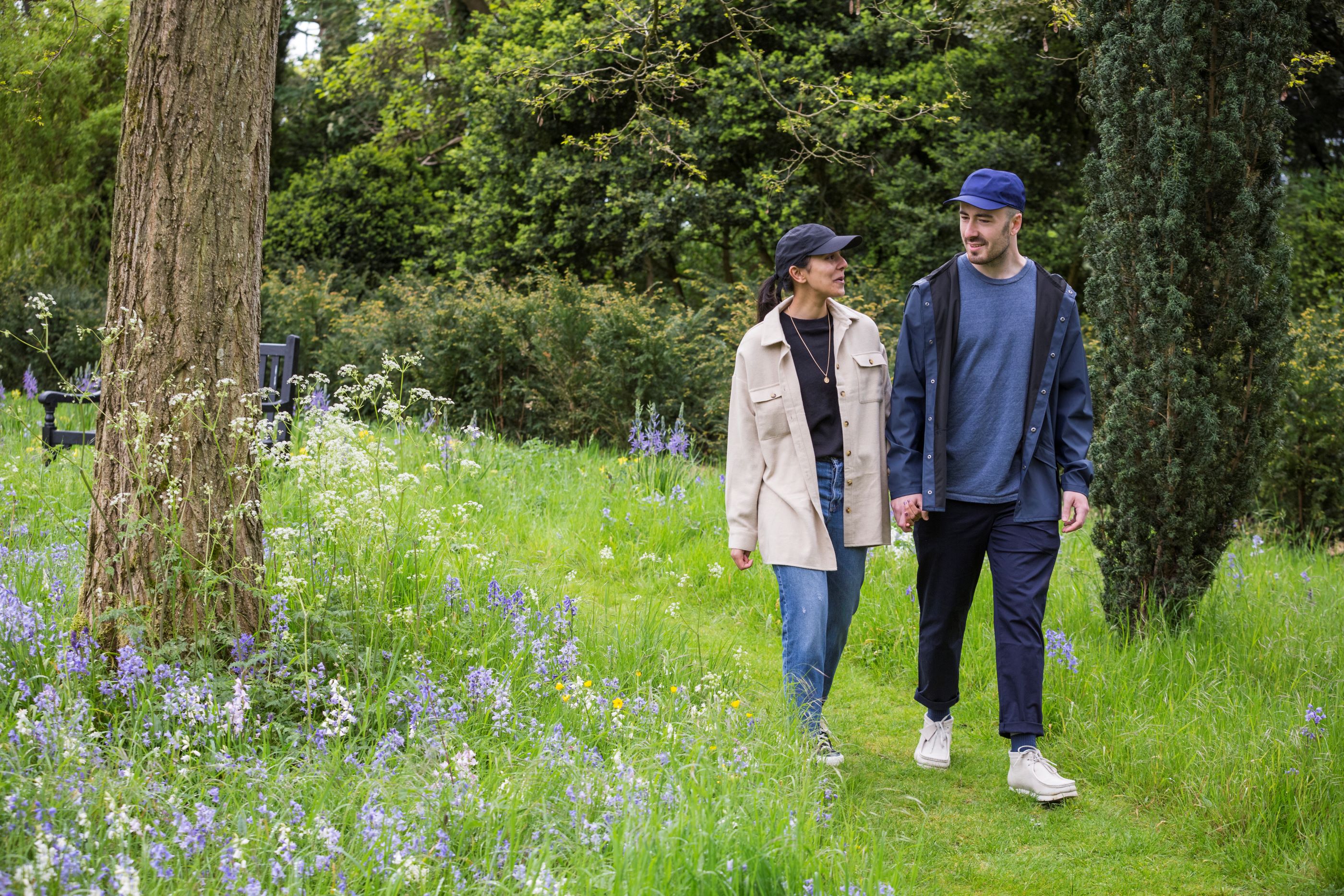 Man and woman walking in the garden at Ickworth in spring