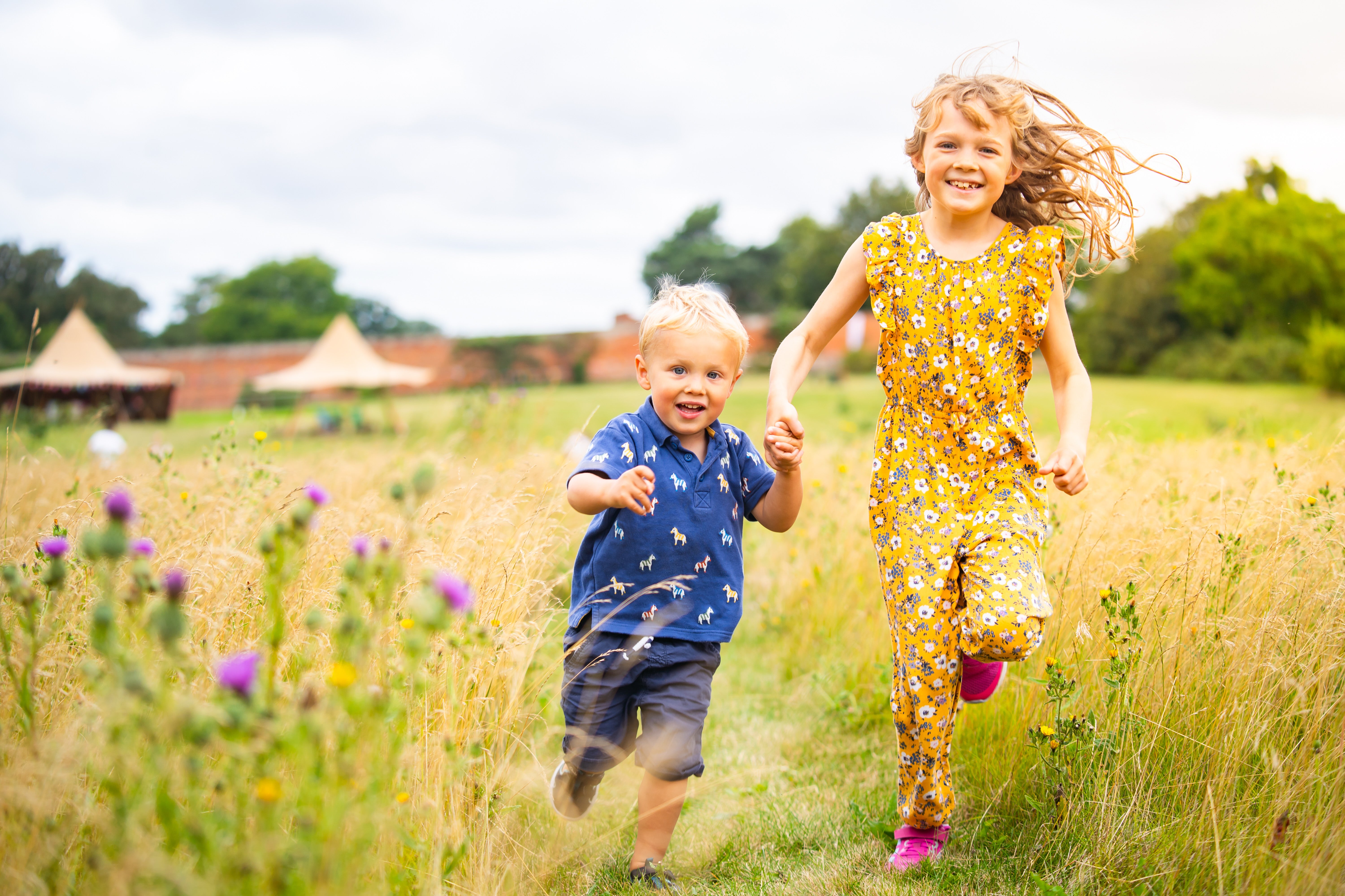 Children run through the Walled Garden at Ickworth Estate
