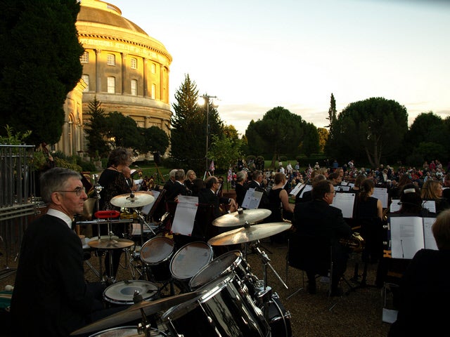 A concert band plays outside the Orangery in the Italianate Garden at Ickworth