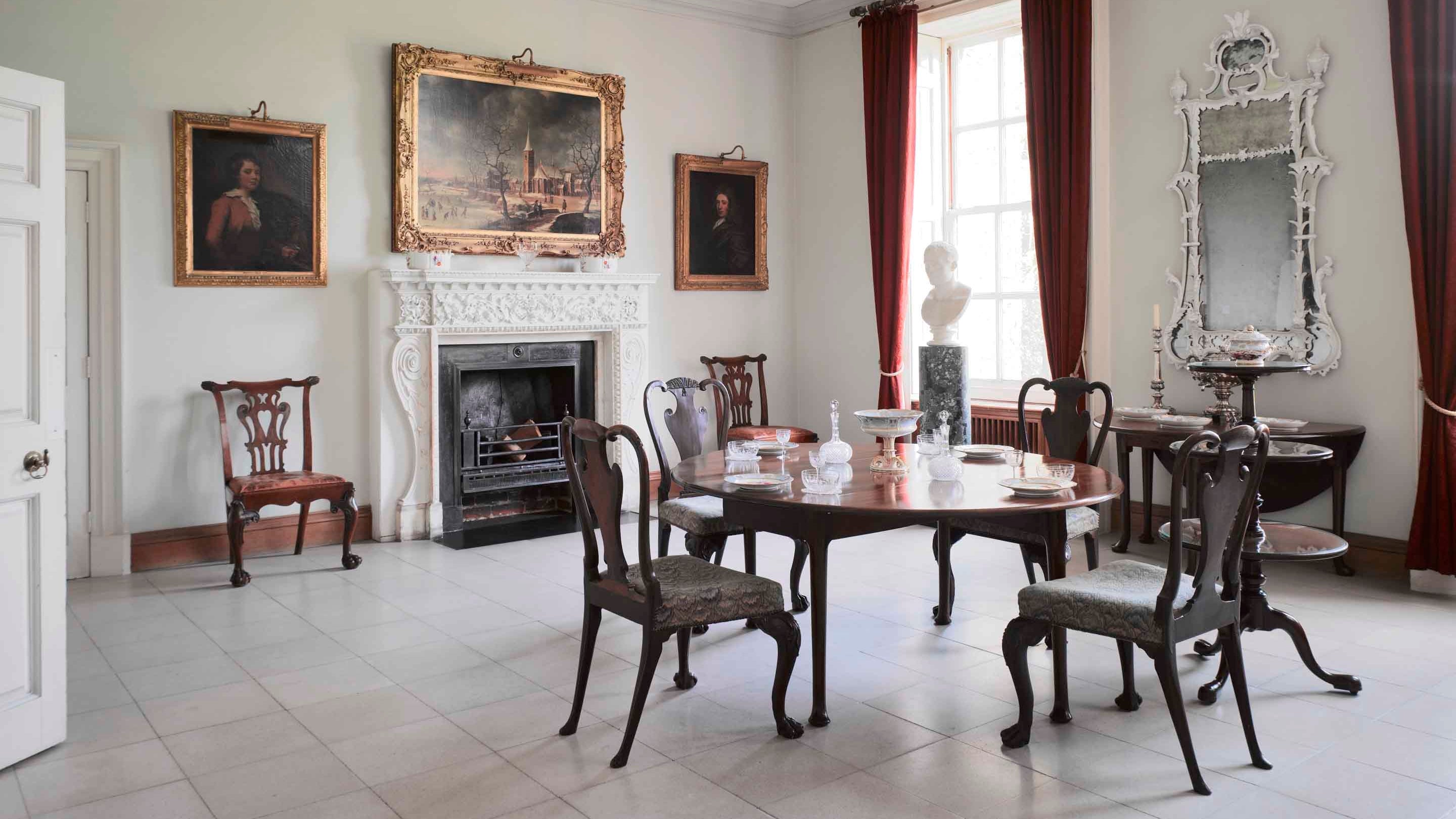 The Dining Room at Melford Hall, Long Melford, Suffolk, showing the pier glass, walnut dining chairs and fireplace