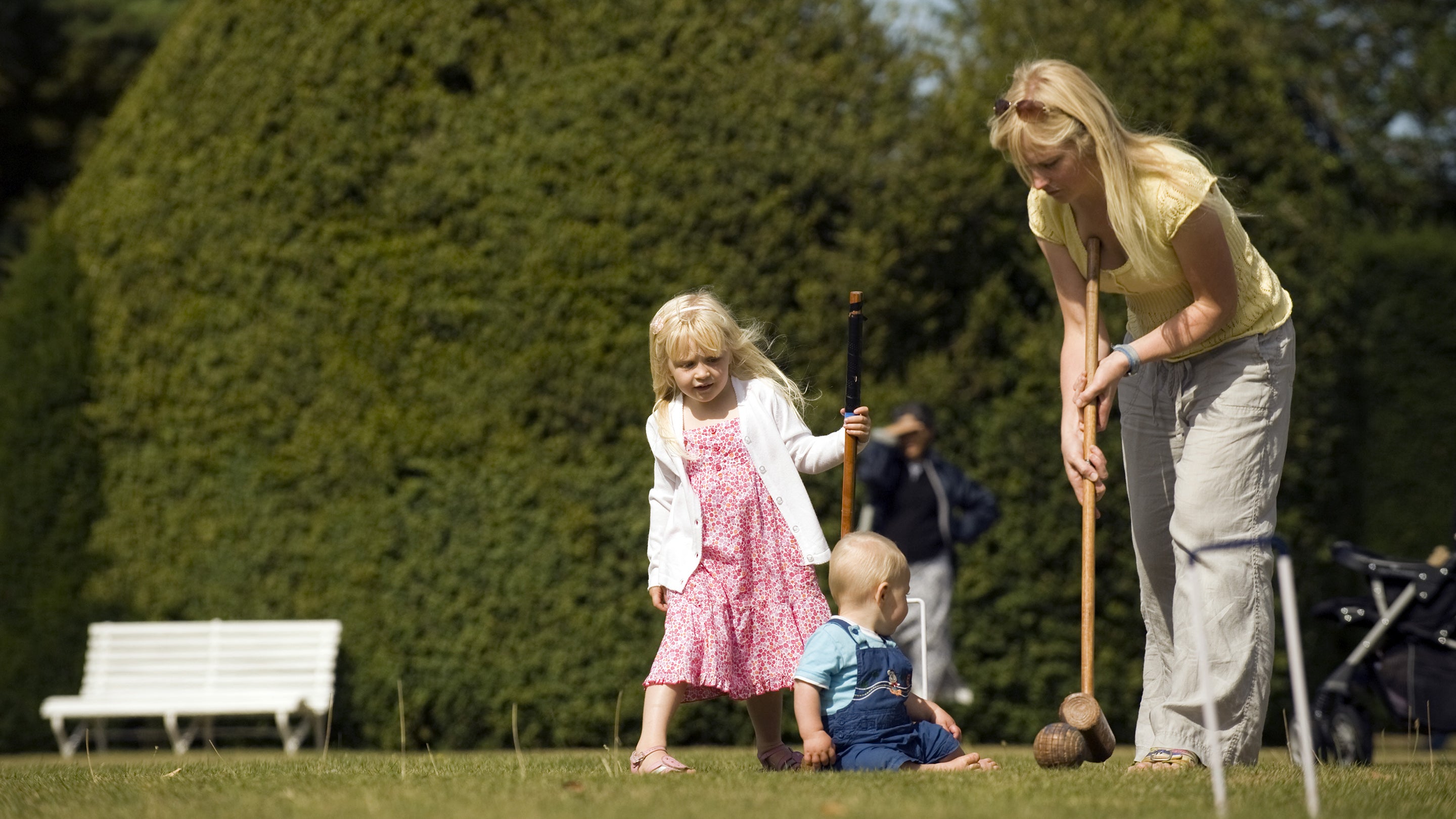 Family playing croquet on the lawn at Melford Hall, Suffolk