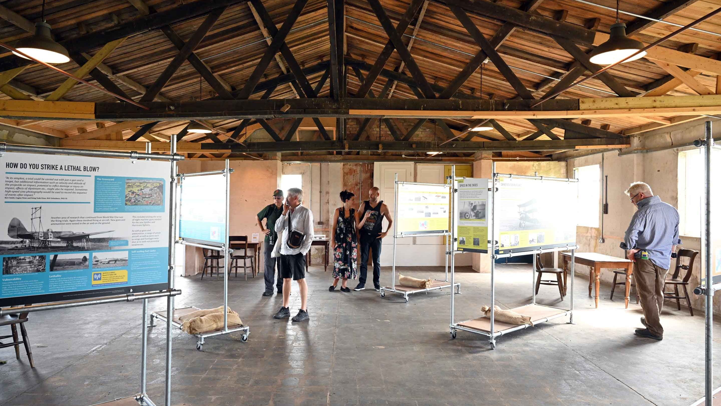 Visitors exploring the Island of Secrets exhibition at Orford Ness National Nature Reserve, Suffolk