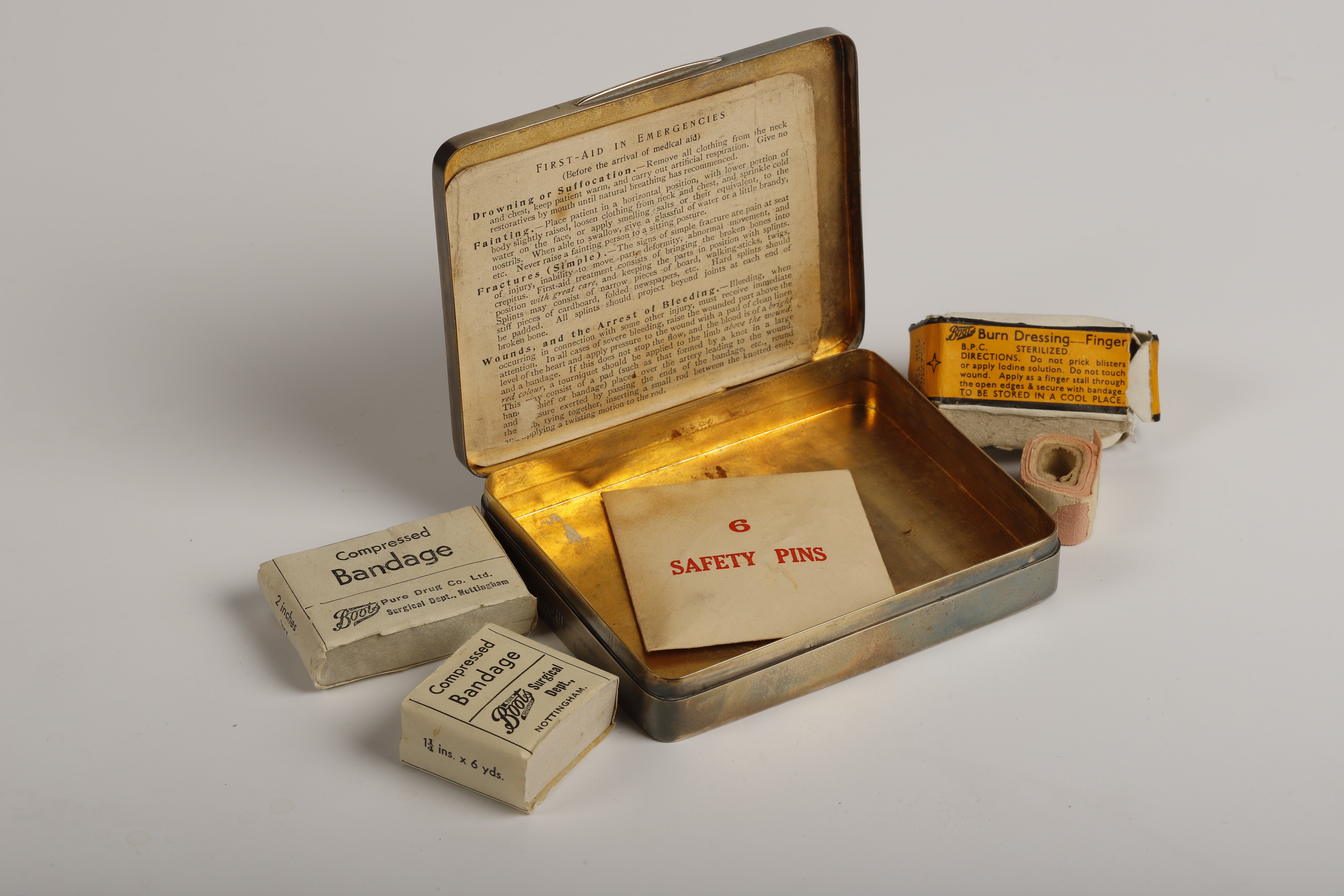 A first aid kit in a tin, which dates back to the early 20th century