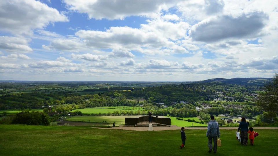 Salomons memorial viewpoint at Box Hill with a family walking in the foreground