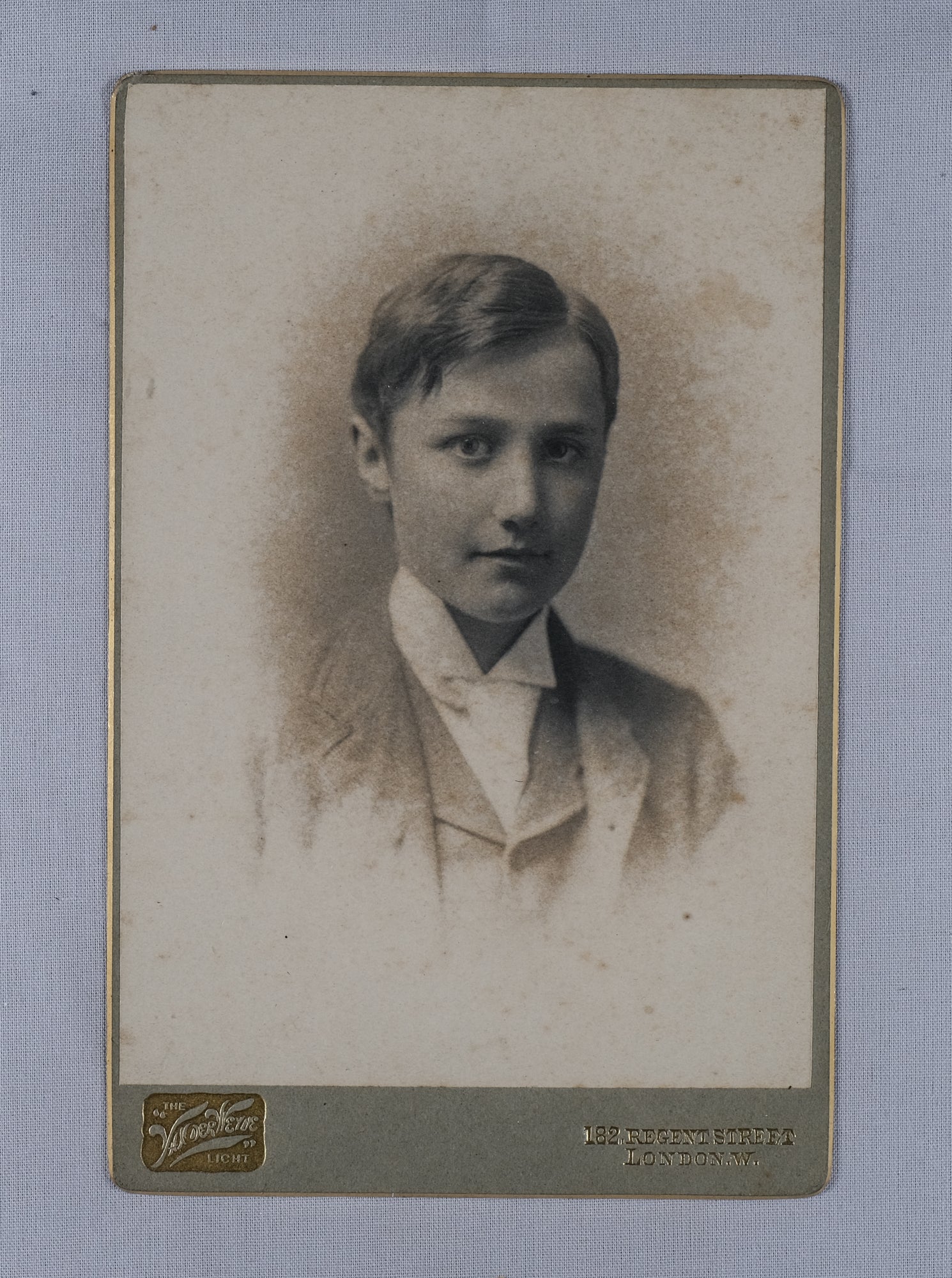 Studio portrait, bust length, of the young Ralph Vaughan Williams in a white tie and Eton collar.