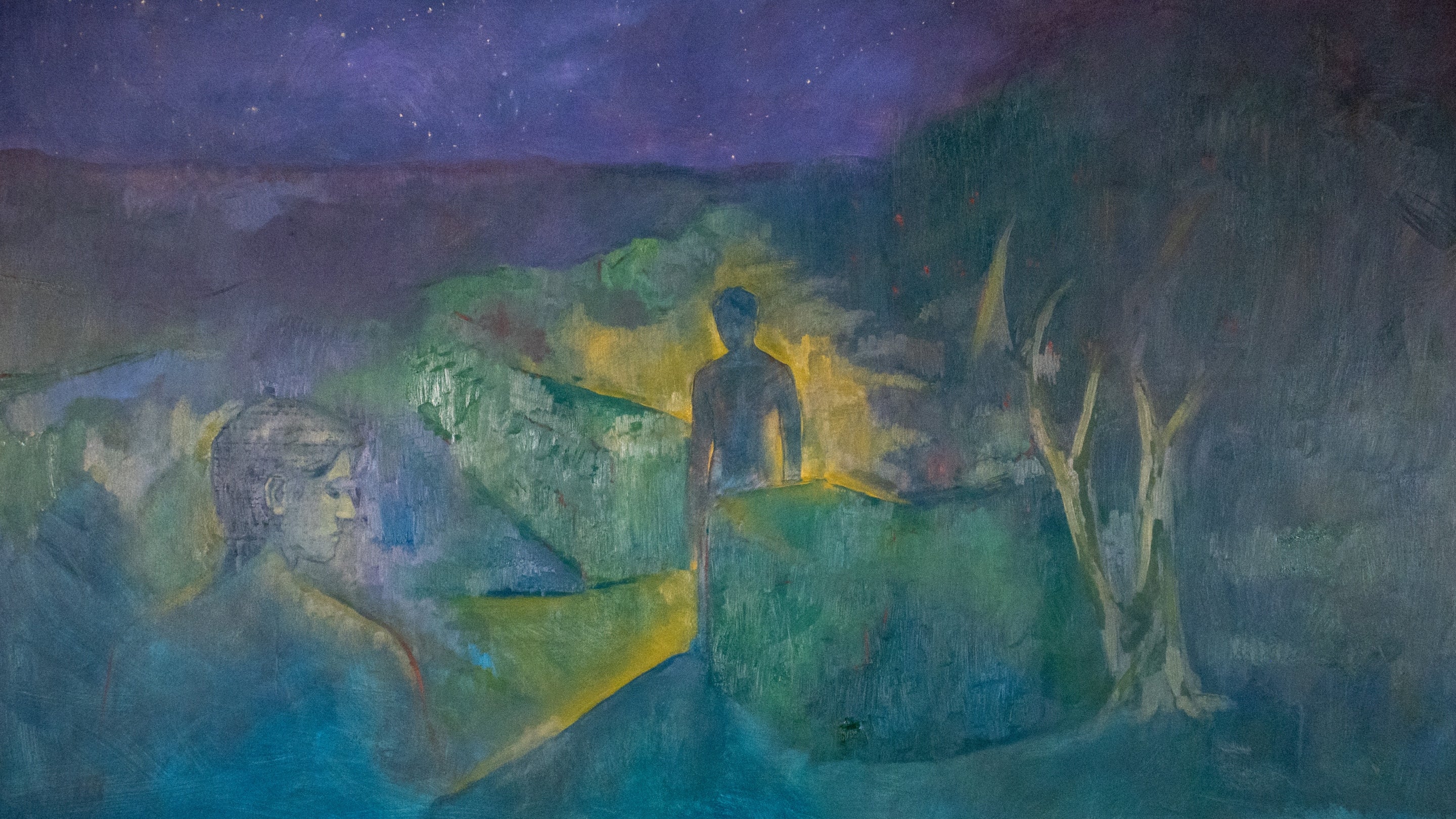 A painting of blue, green and turquoise hues. A figure stands in the middle of the artwork surrounded by a yellow glow. Another figure looks on