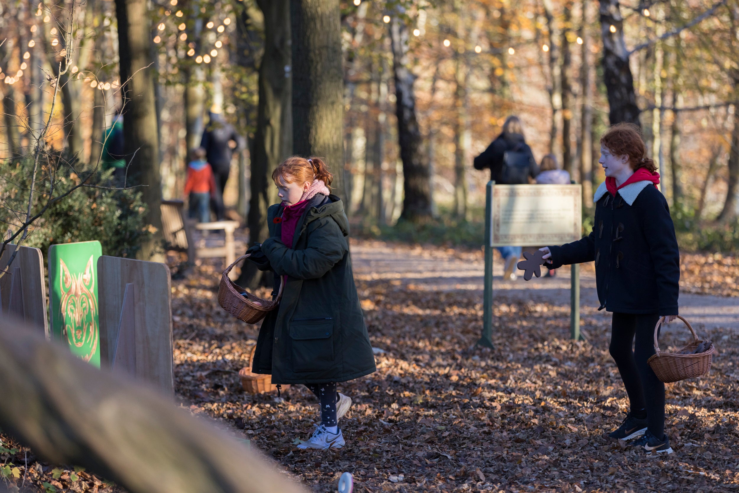 Children playing games on a fairytale trail at Christmas