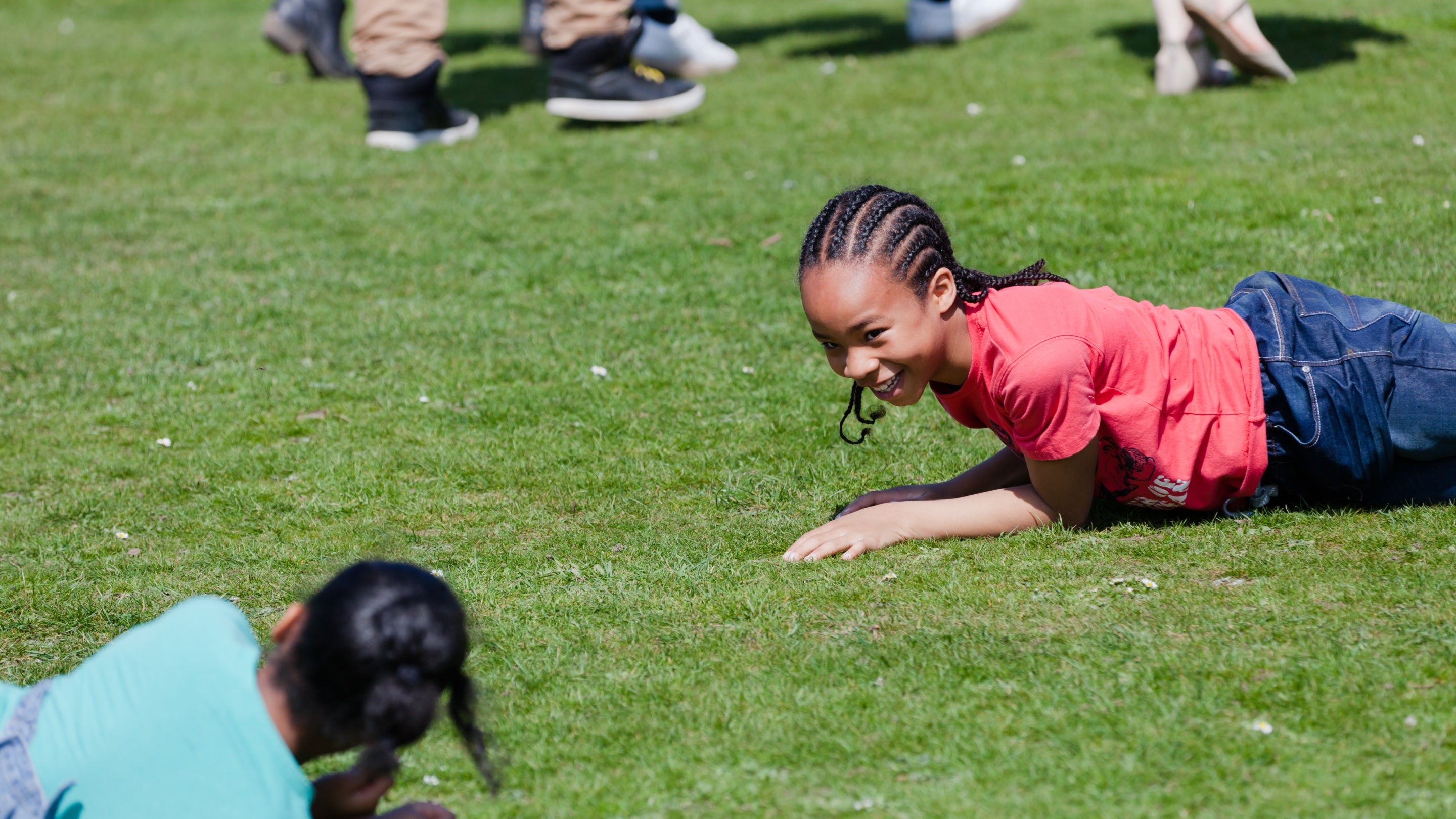 Two girls lying on the grass at Polesden Lacey, Surrey