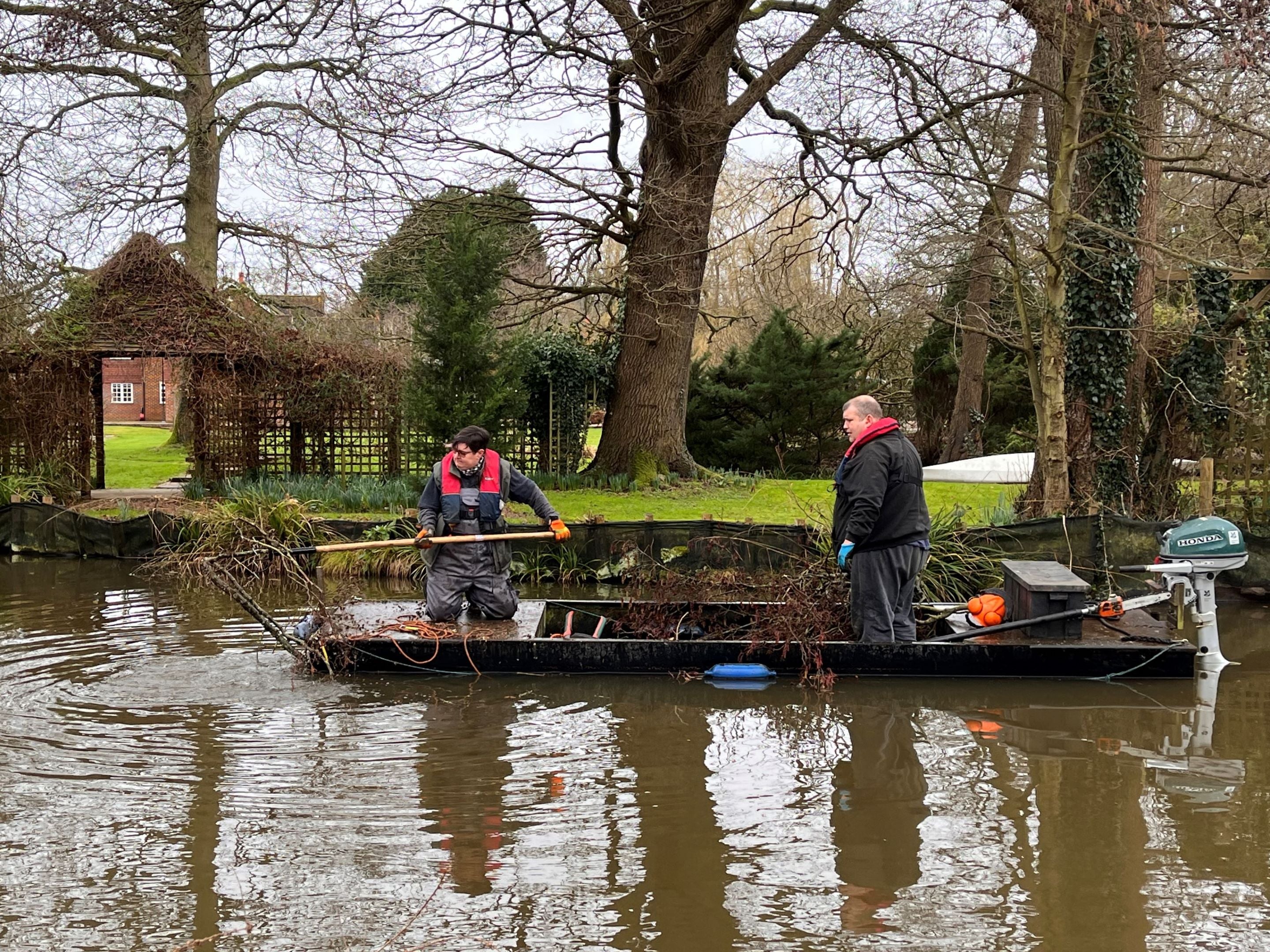Lengthsman Emma in punt, clearing overhanging branches
