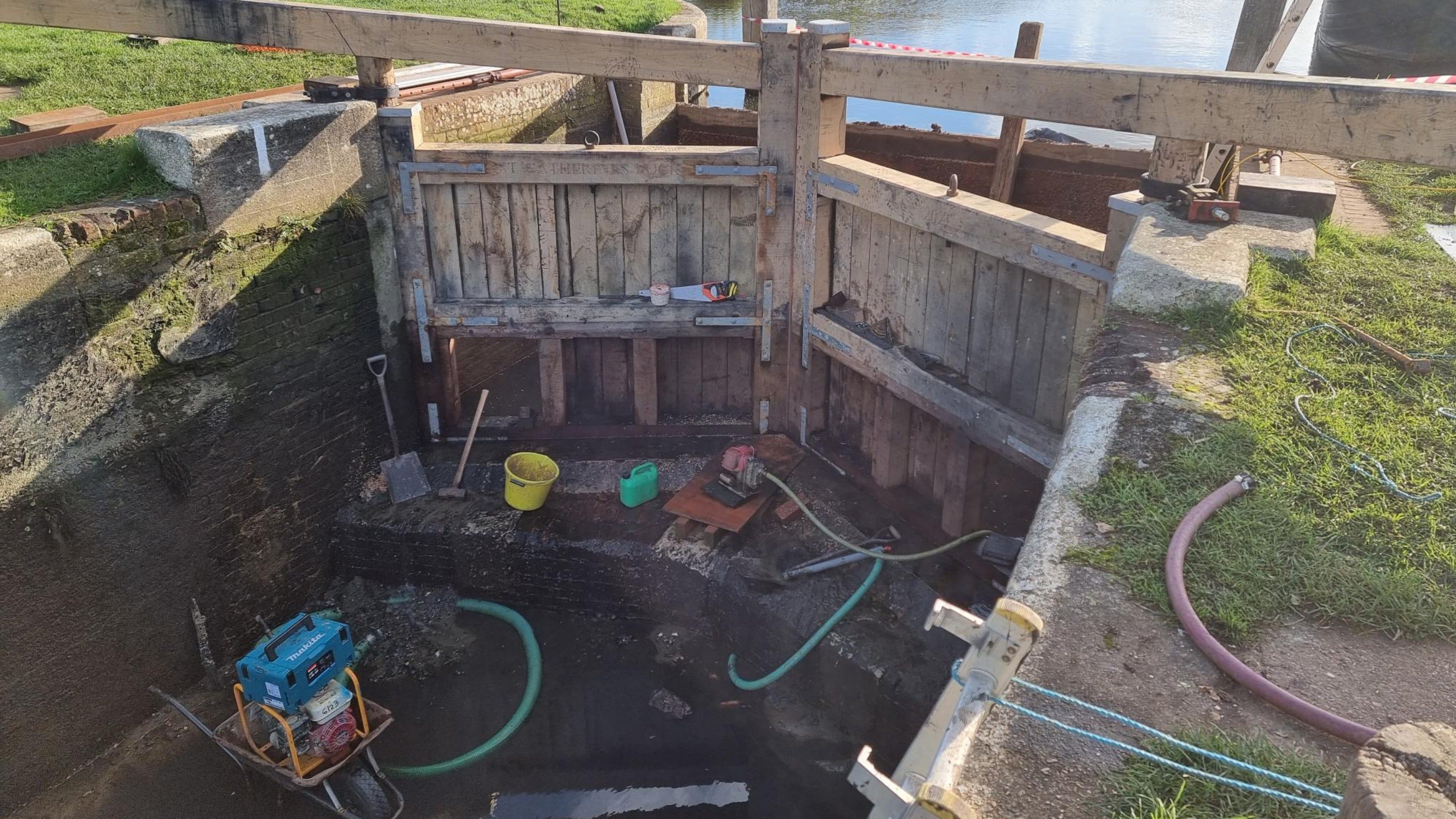 New upper lock gates in front of the drained lock and dam at St Catherine’s on the River Wey, Surrey