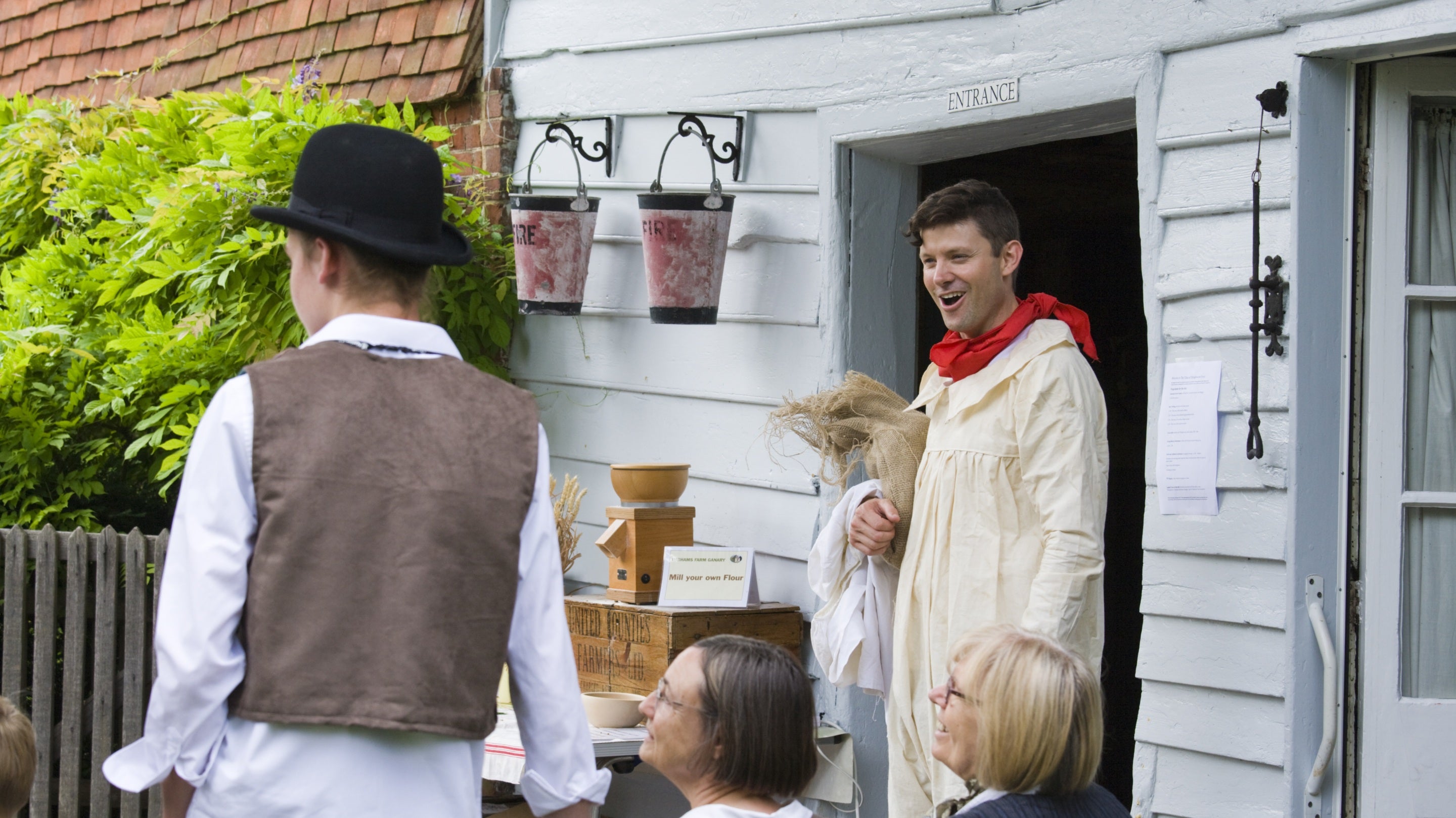 Volunteers dressed up in period costumes at Shalford Mill, Surrey