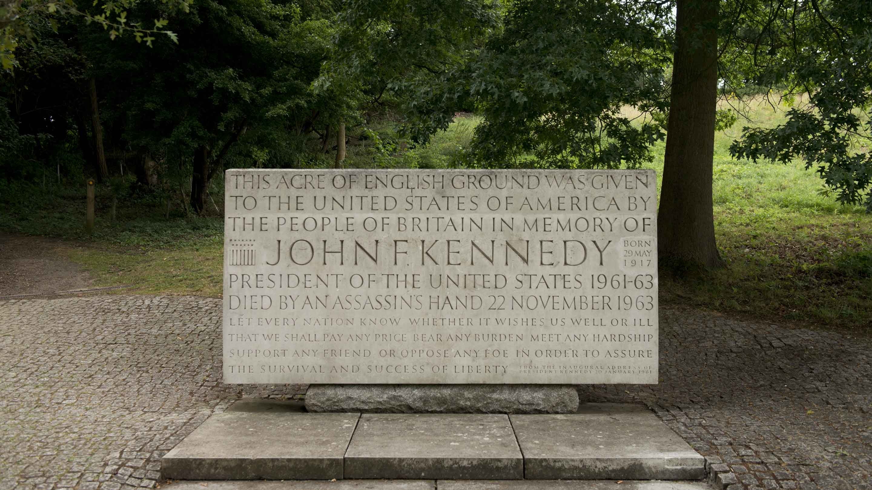 This rectangular block of pale Portland stone is a memorial to assassinated US president John F Kennedy, and is carved with words from his inaugural address in 1961