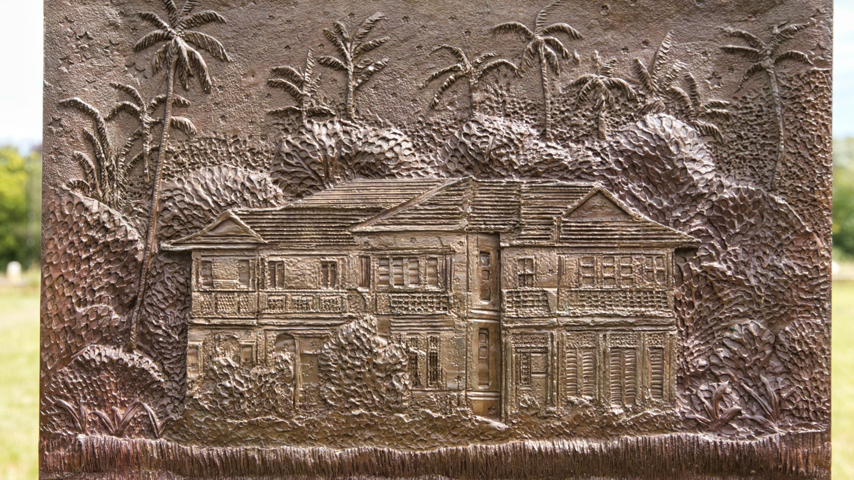 Close up of Chair 12 of The Jurors by Hew Locke, showing house in Yangon, Burma, where politician Aung San Suu Kyi was held under house arrest for 15 out of 21 years until her release in 2010