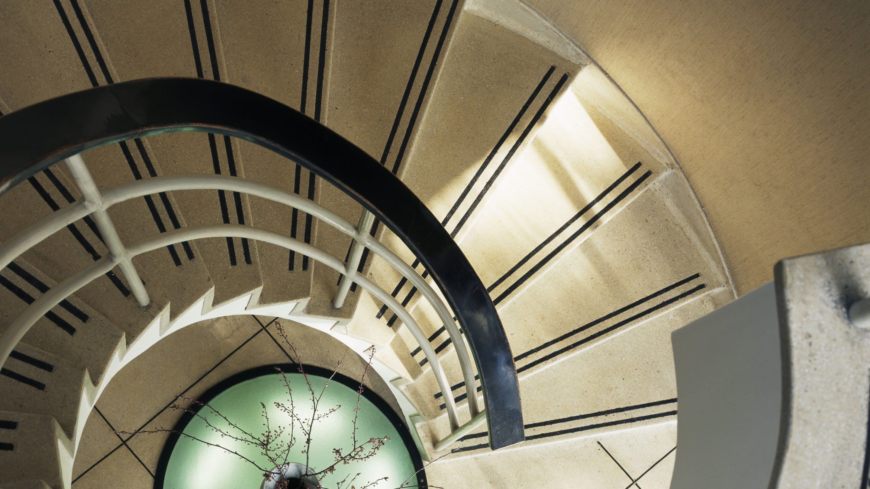 A view looking down the striking spiral staircase at The Homewood, Surrey