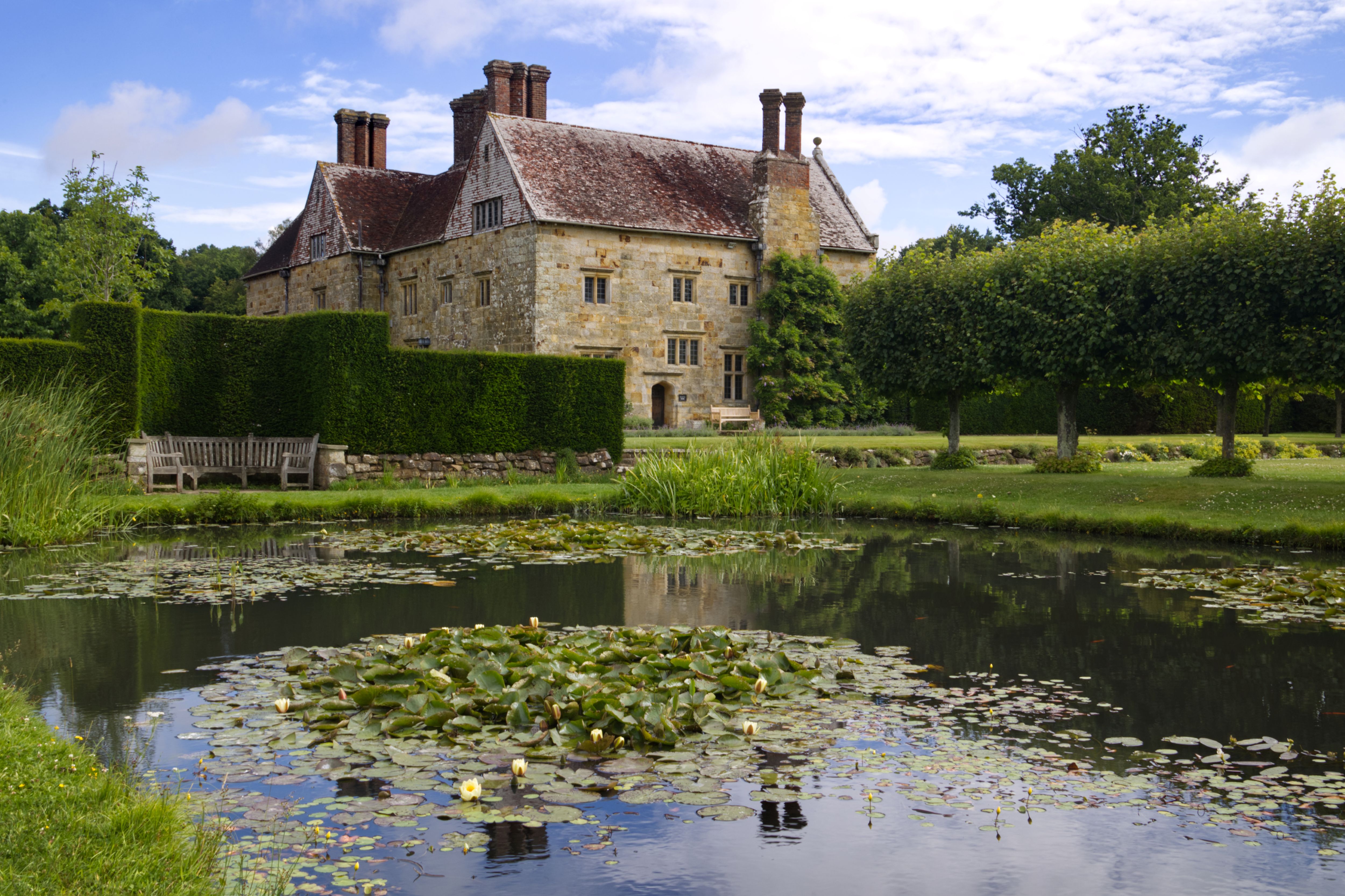 House reflection on the lily pond at Bateman's, East Sussex