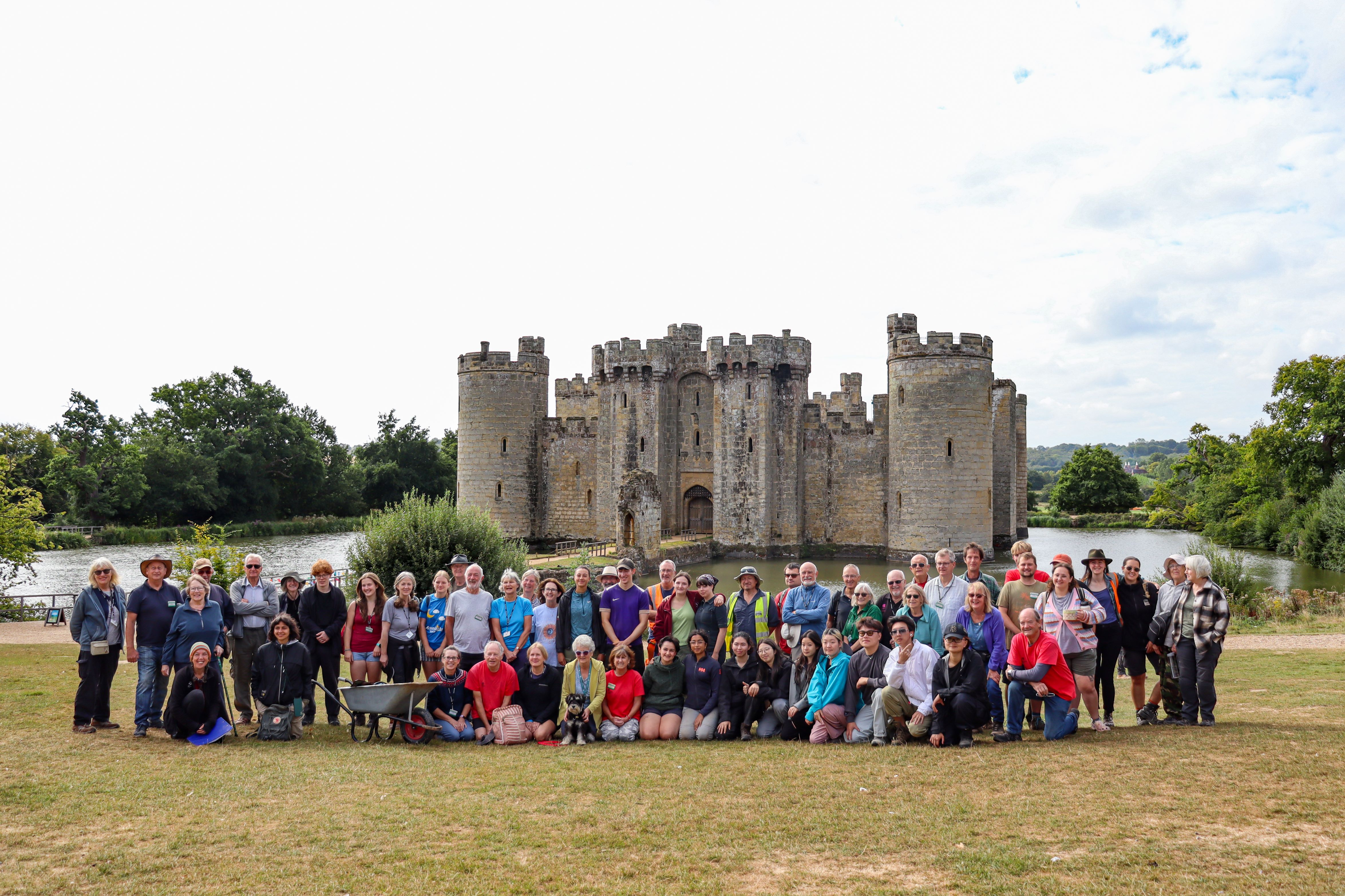 Group of volunteers and archaeologists at an excavation site at Bodiam Castle