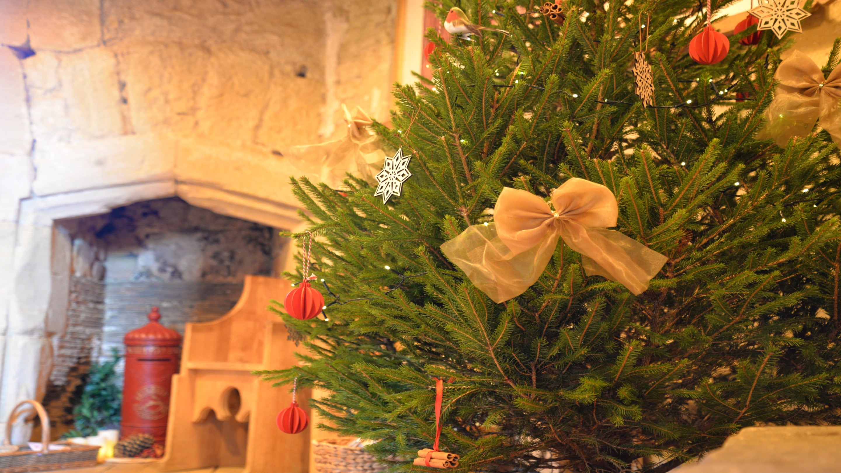 Tower room at Bodiam Castle with decorated Christmas tree and Father Christmas post box