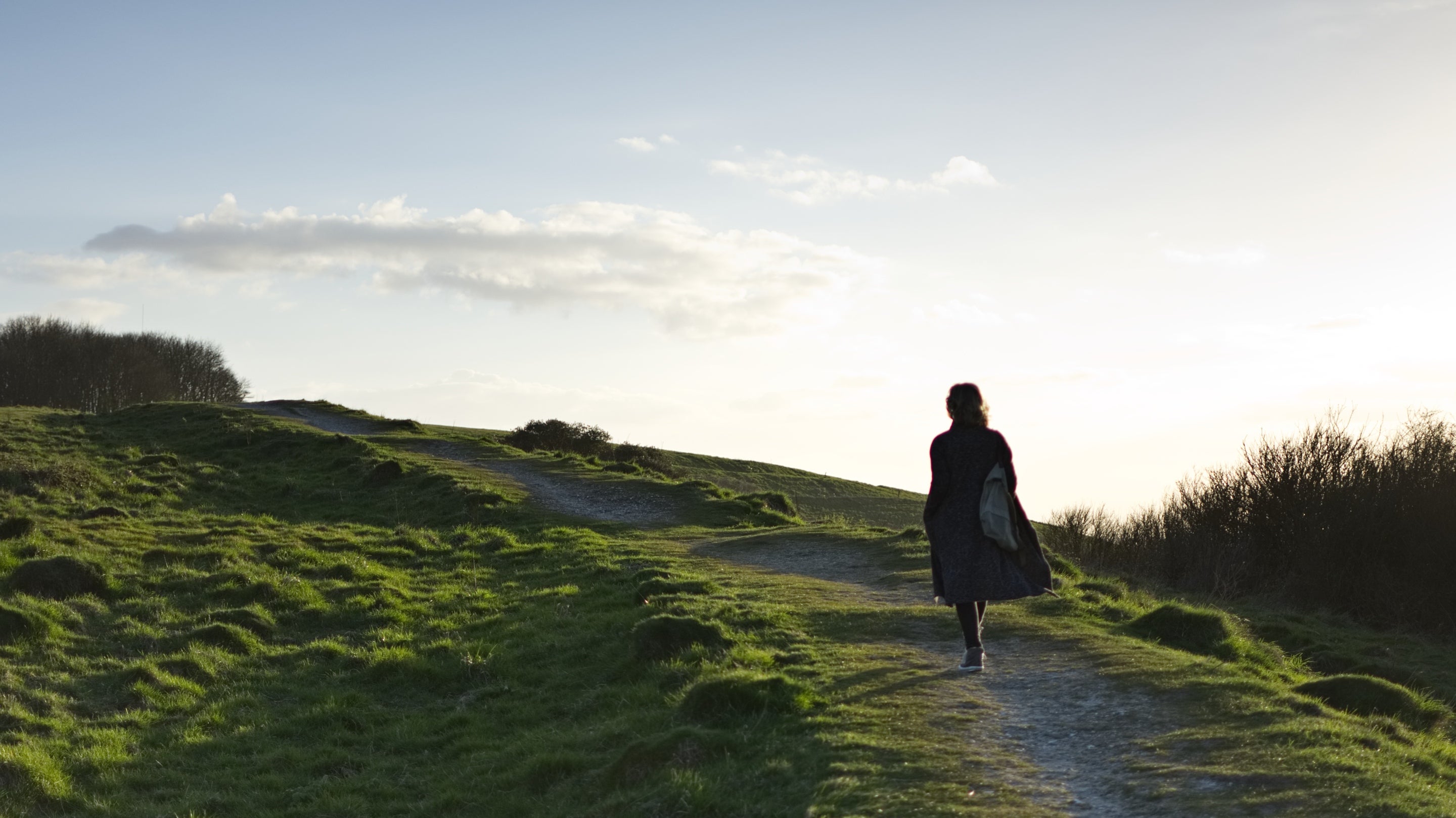 A woman walking in the evening at Devil's Dyke, Sussex