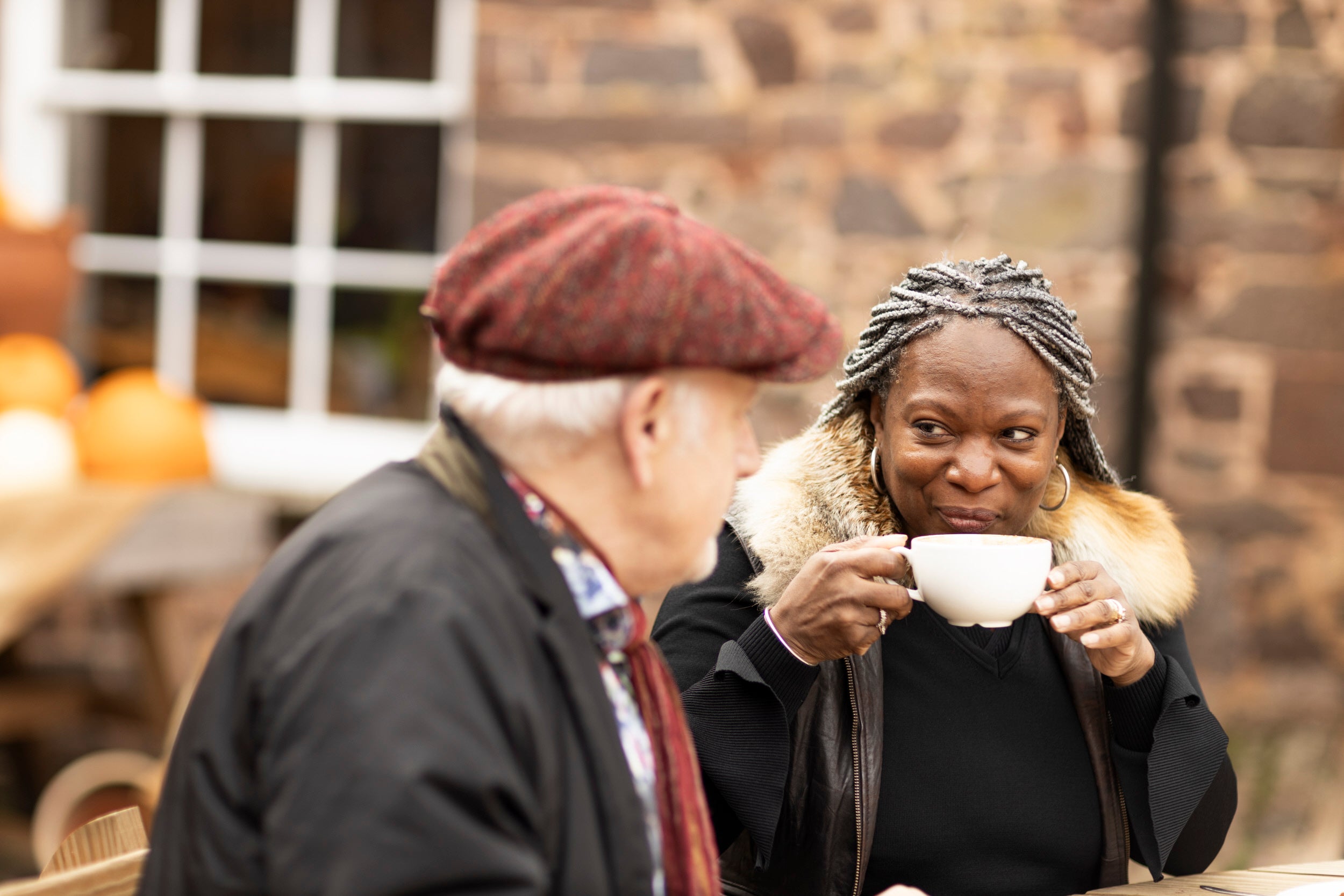 Visitors relaxing outside with refreshments