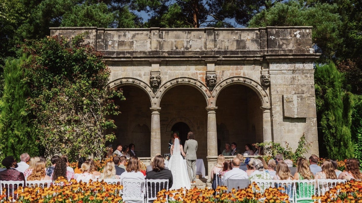 A wedding group at Nymans in the Loggia