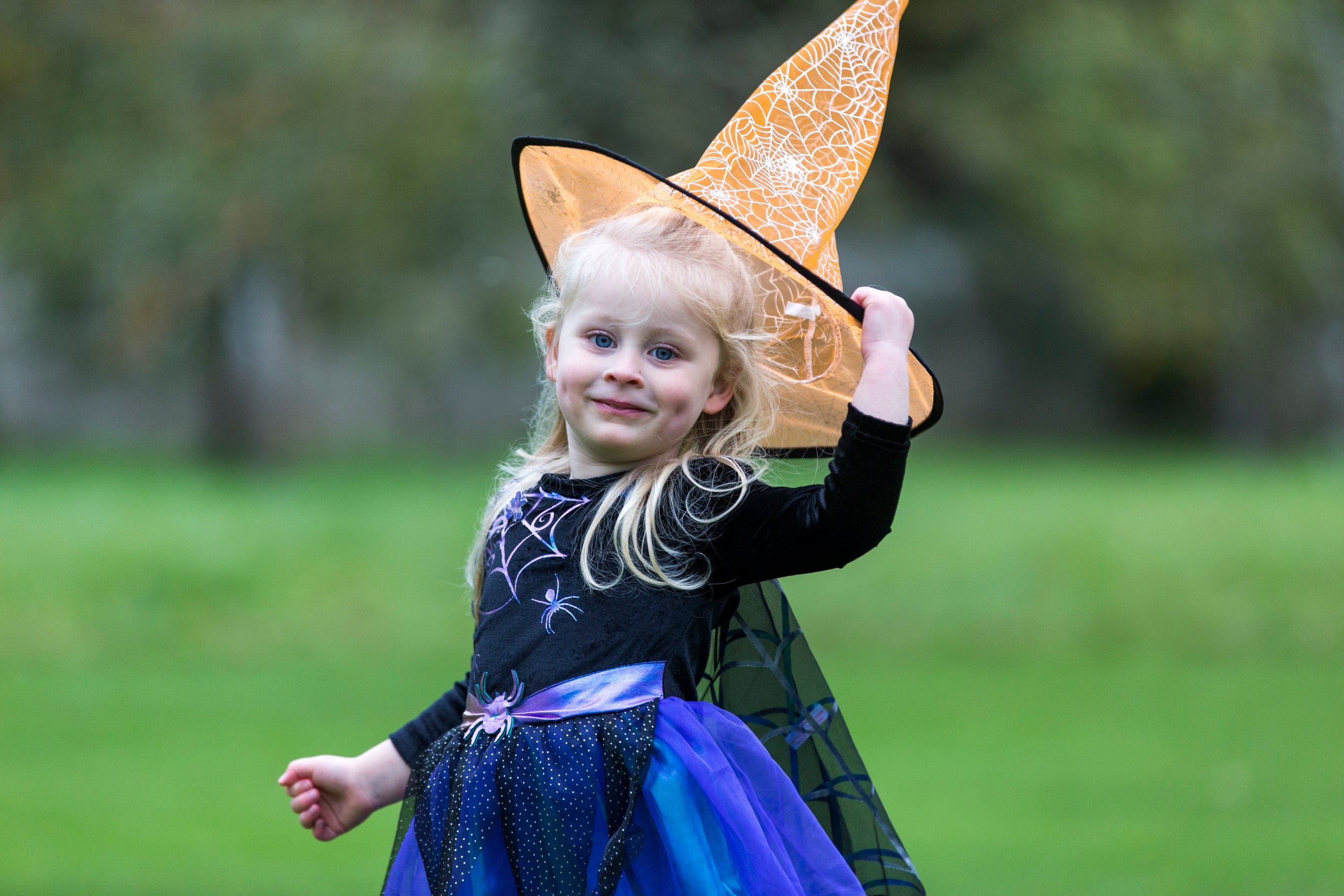 Little girl dressed as a witch at Halloween