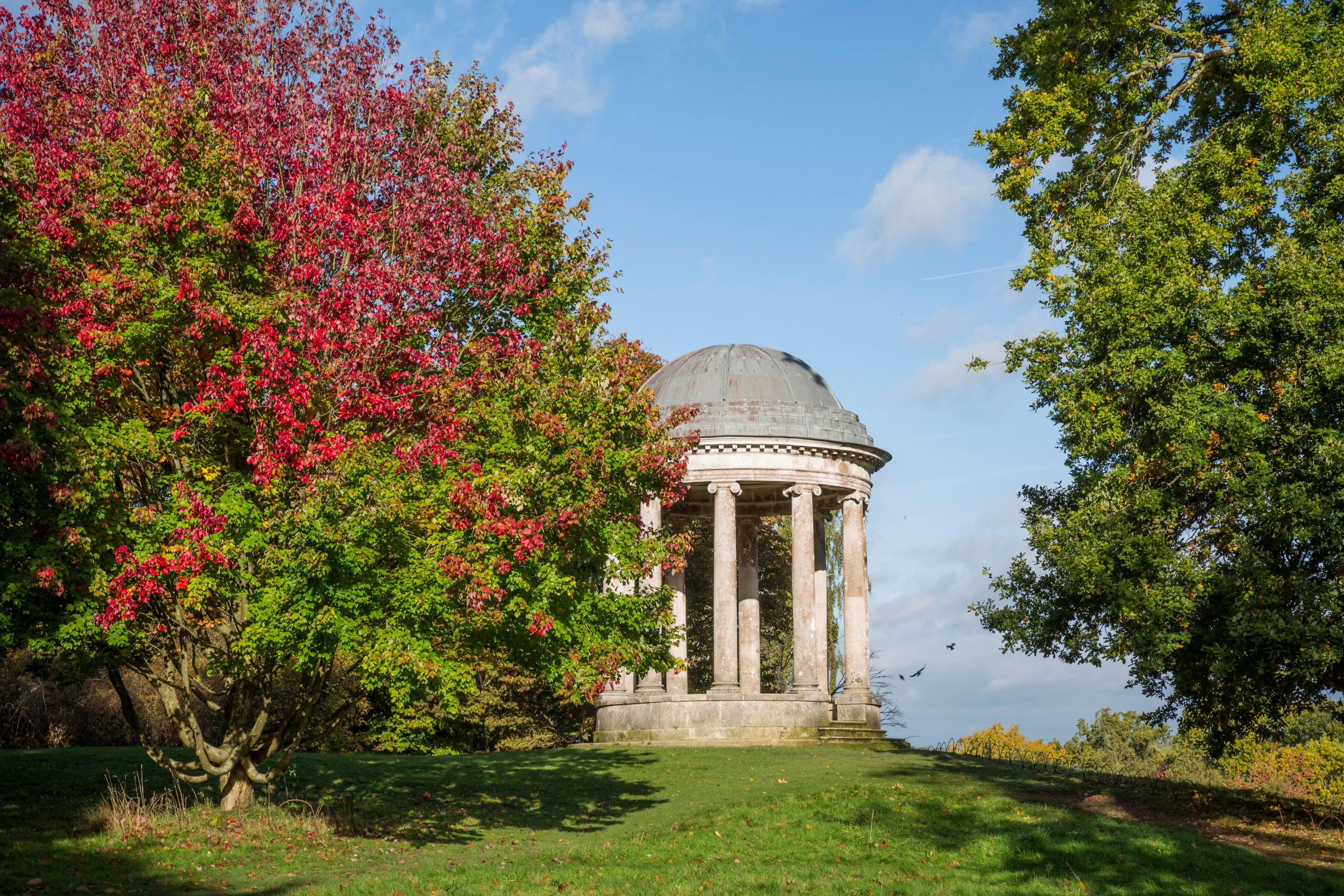 The Ionic Rotunda surrounded with autumnal trees at Petworth, West Sussex