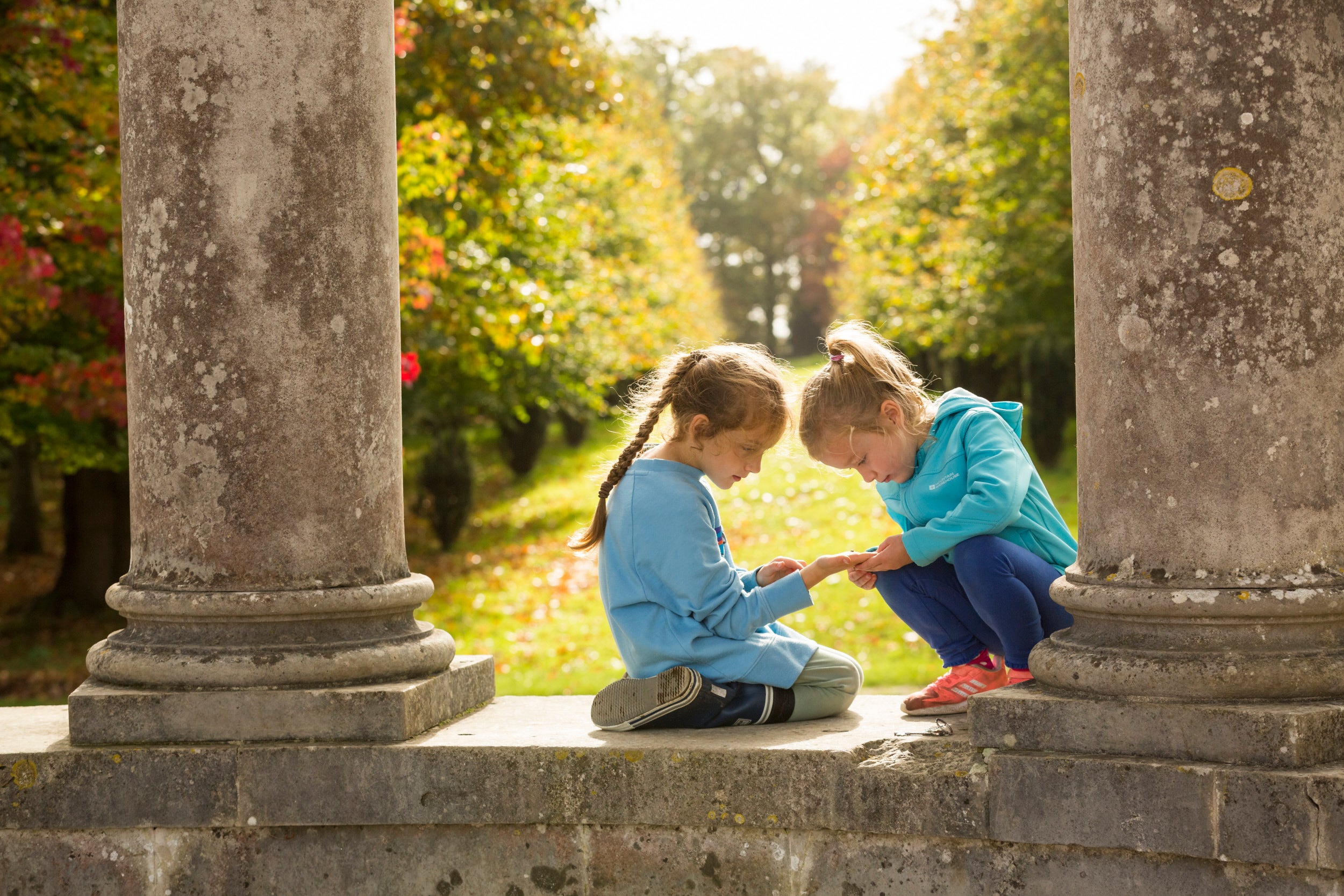 Family exploring nature in the garden at Petworth