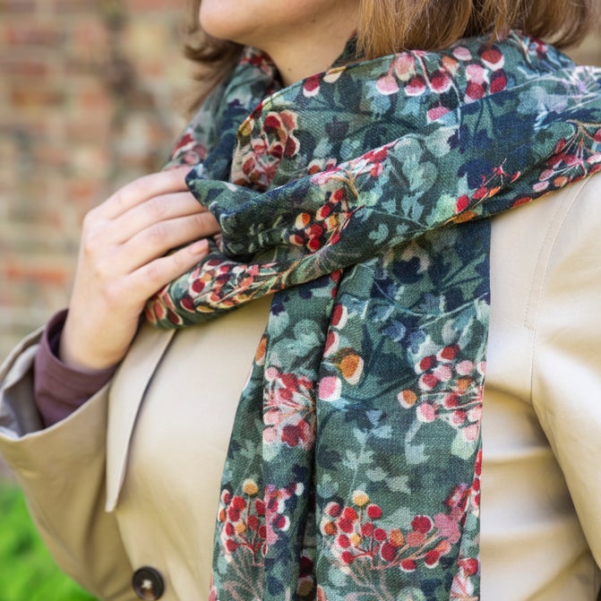 Blue/green patterned scarf with red berries