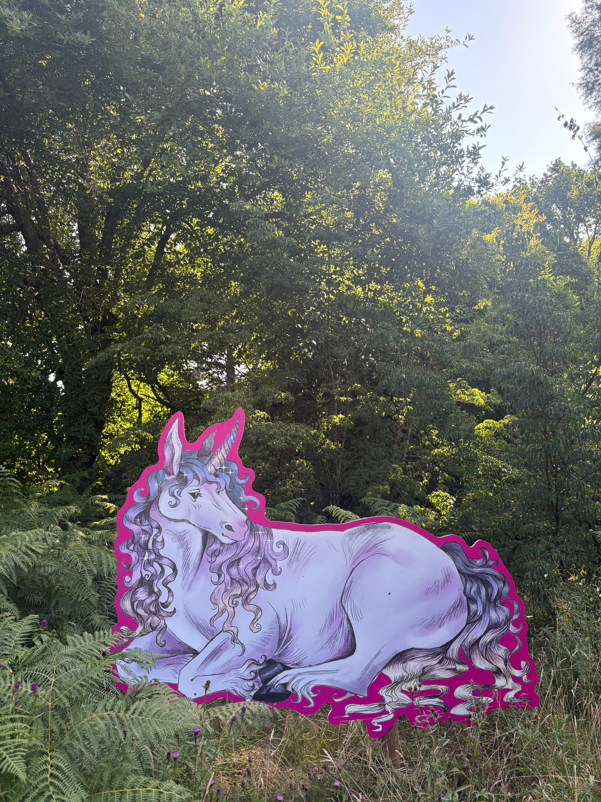 A unicorn illustration sat amongst the planting at Sheffield Park and Garden