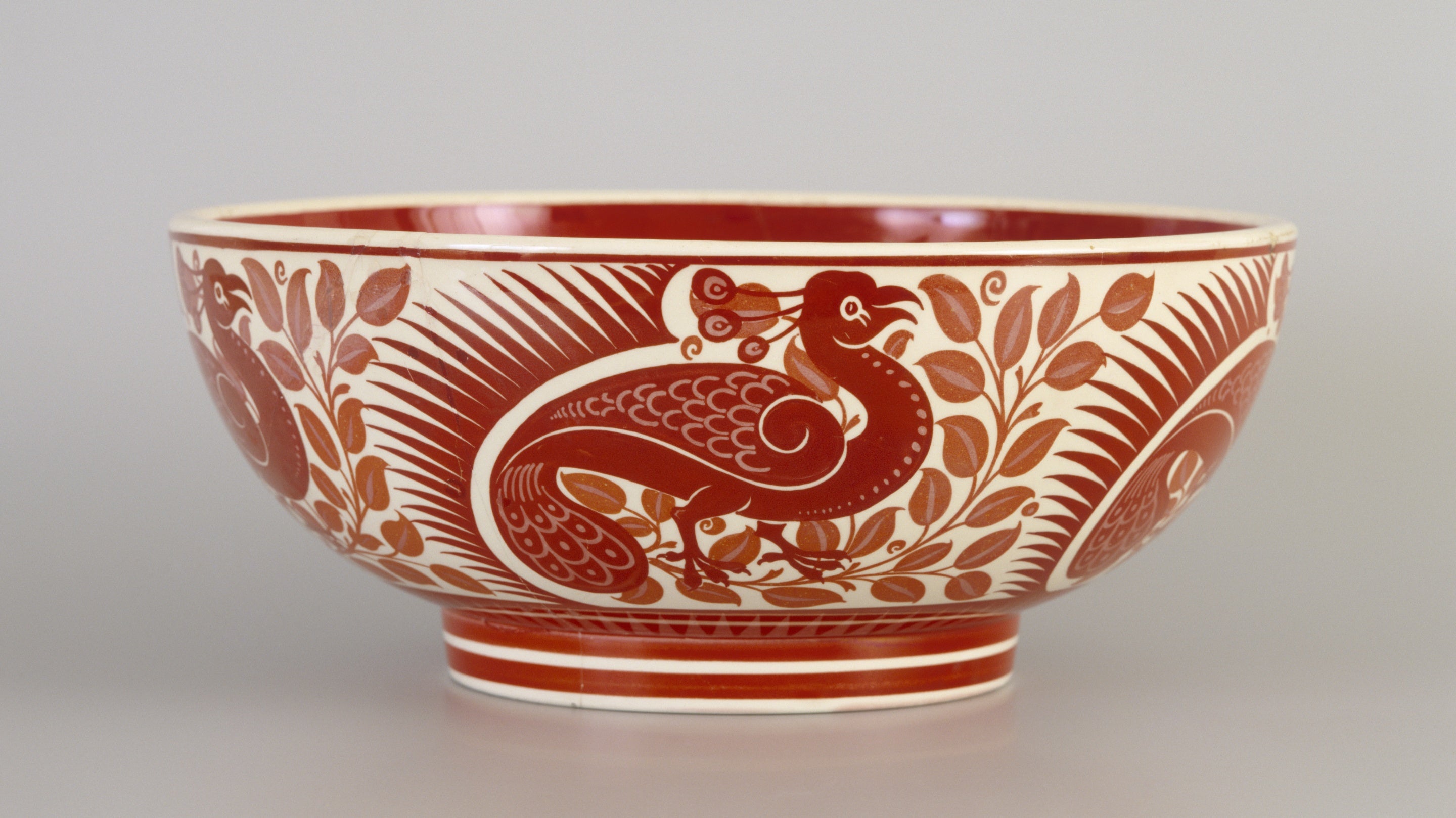 William de Morgan (1839-1917) ruby and pink lustre De Morgan bowl by Charles Passenger in The Billiard Room at Standen, West Sussex