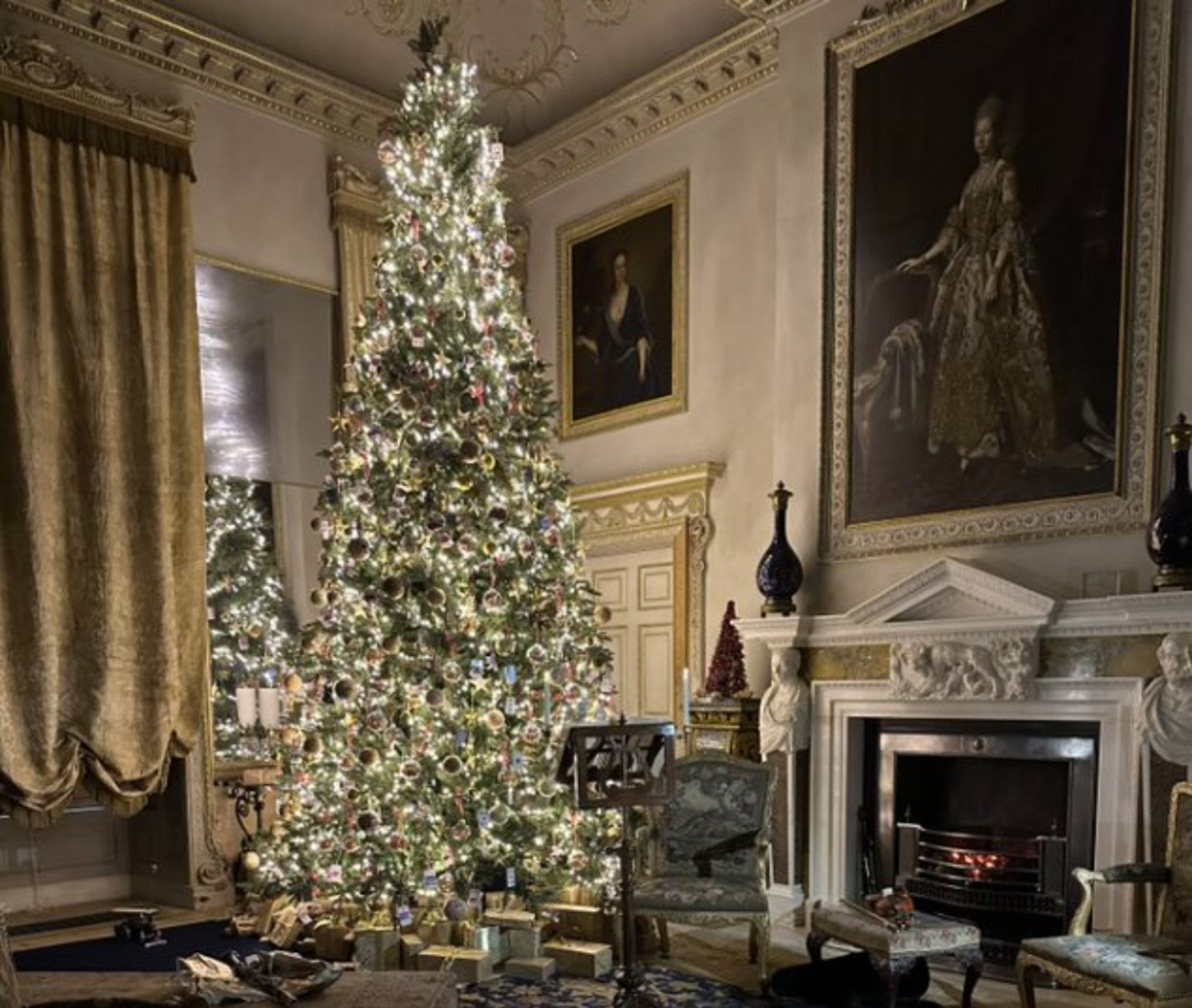 A large decorated Christmas tree in the Saloon at Uppark