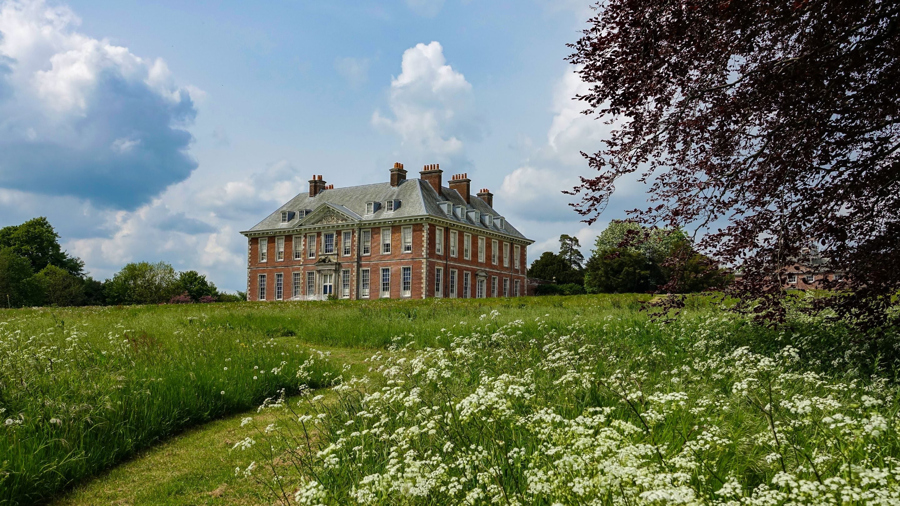 View of the house at the top of the hill from below, summer, Uppark House, West Sussex