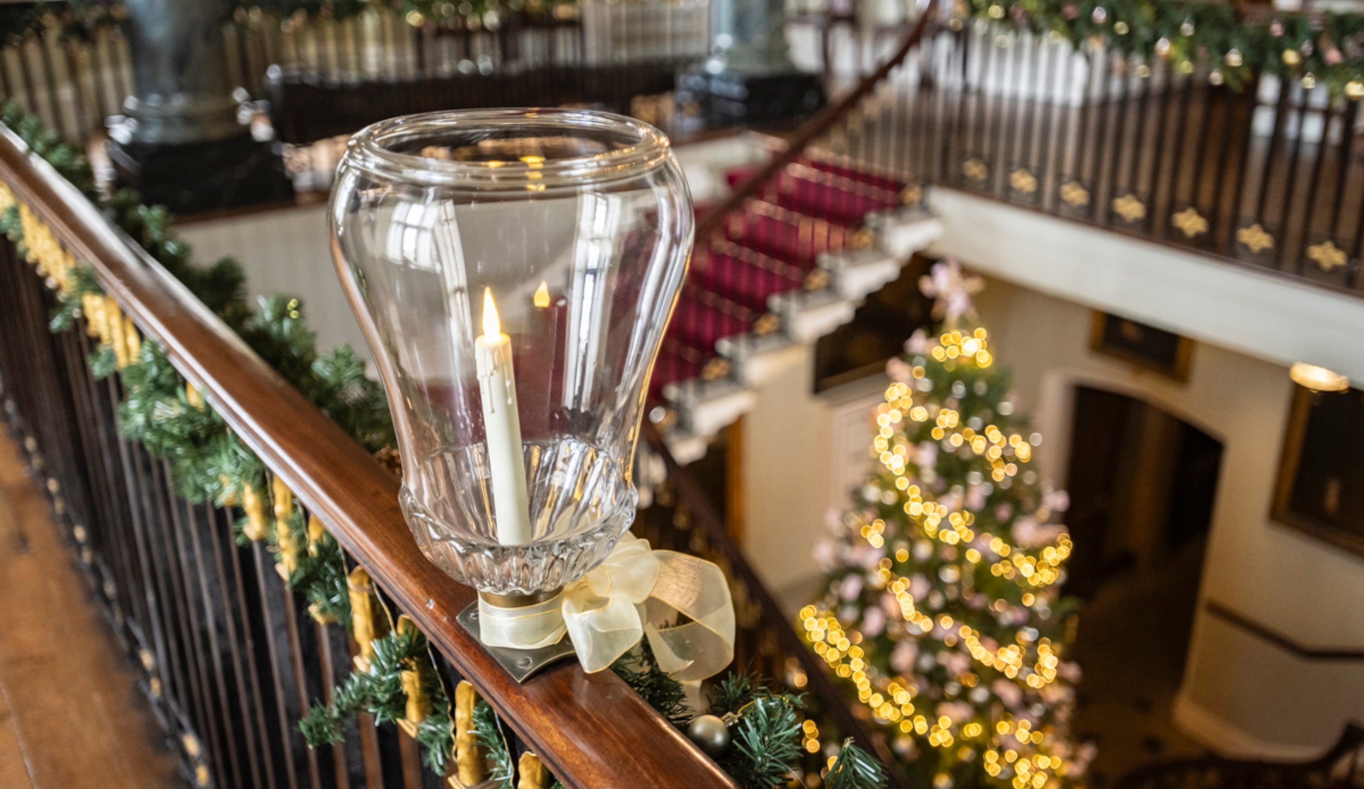 The grand staircase decorated for Christmas at Chirk Castle