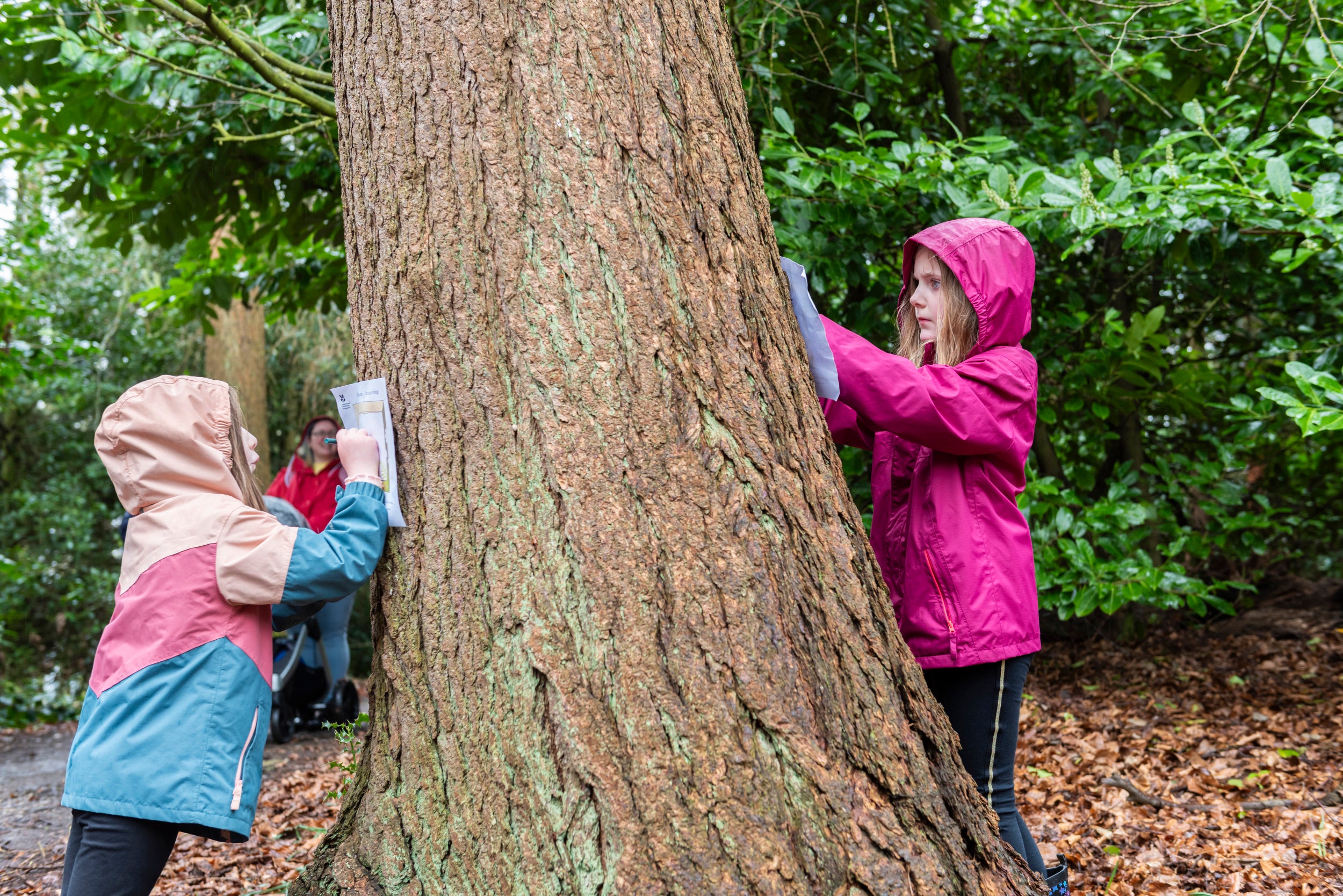 Families enjoying the Easter trail in the garden at Chirk Castle, Wrexham
