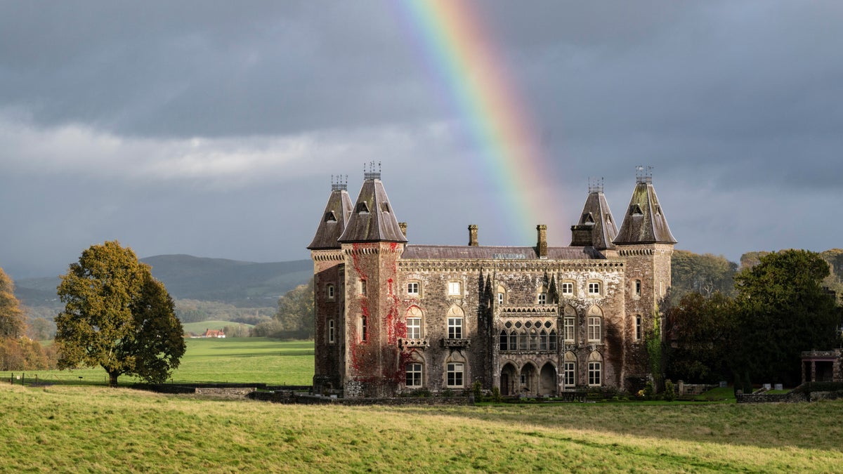 Newton House and Dinefwr parkland beneath an autumn rainbow