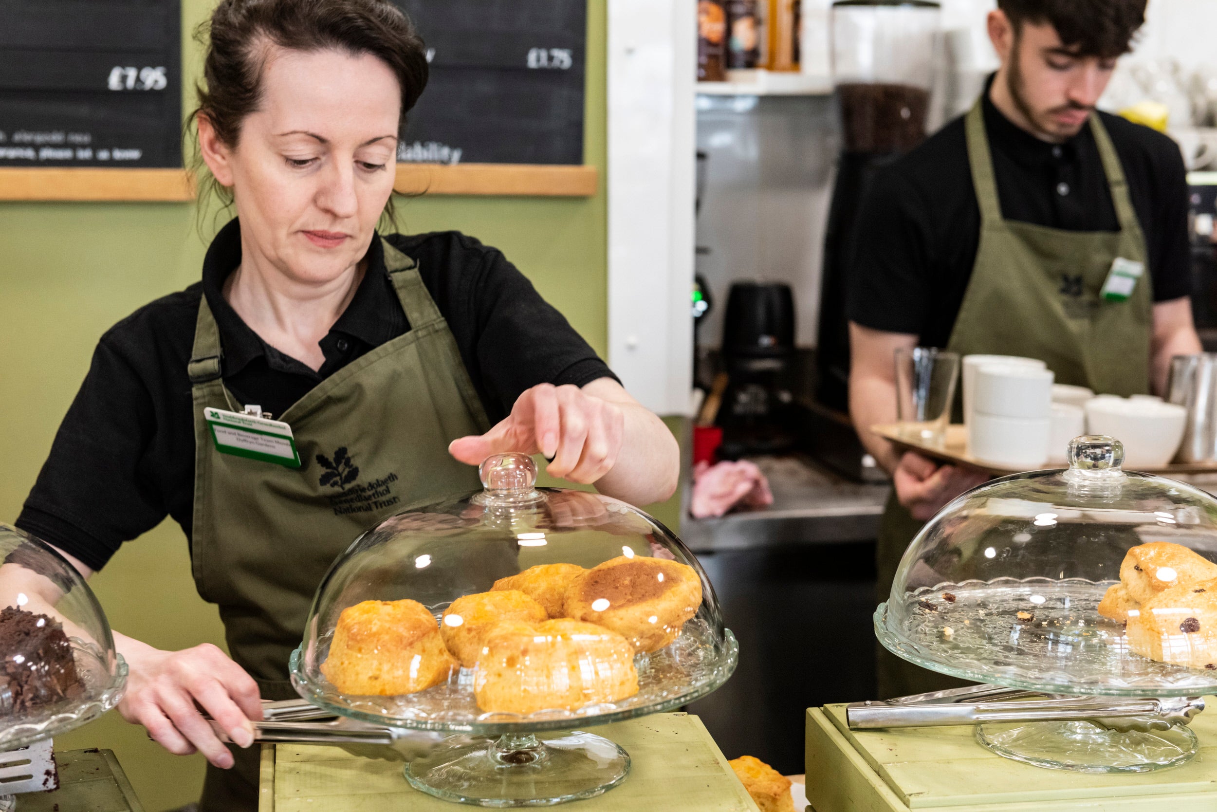 A café colleague preparing an order in the Gardens Café at Dyffryn Gardens, Vale of Glamorgan