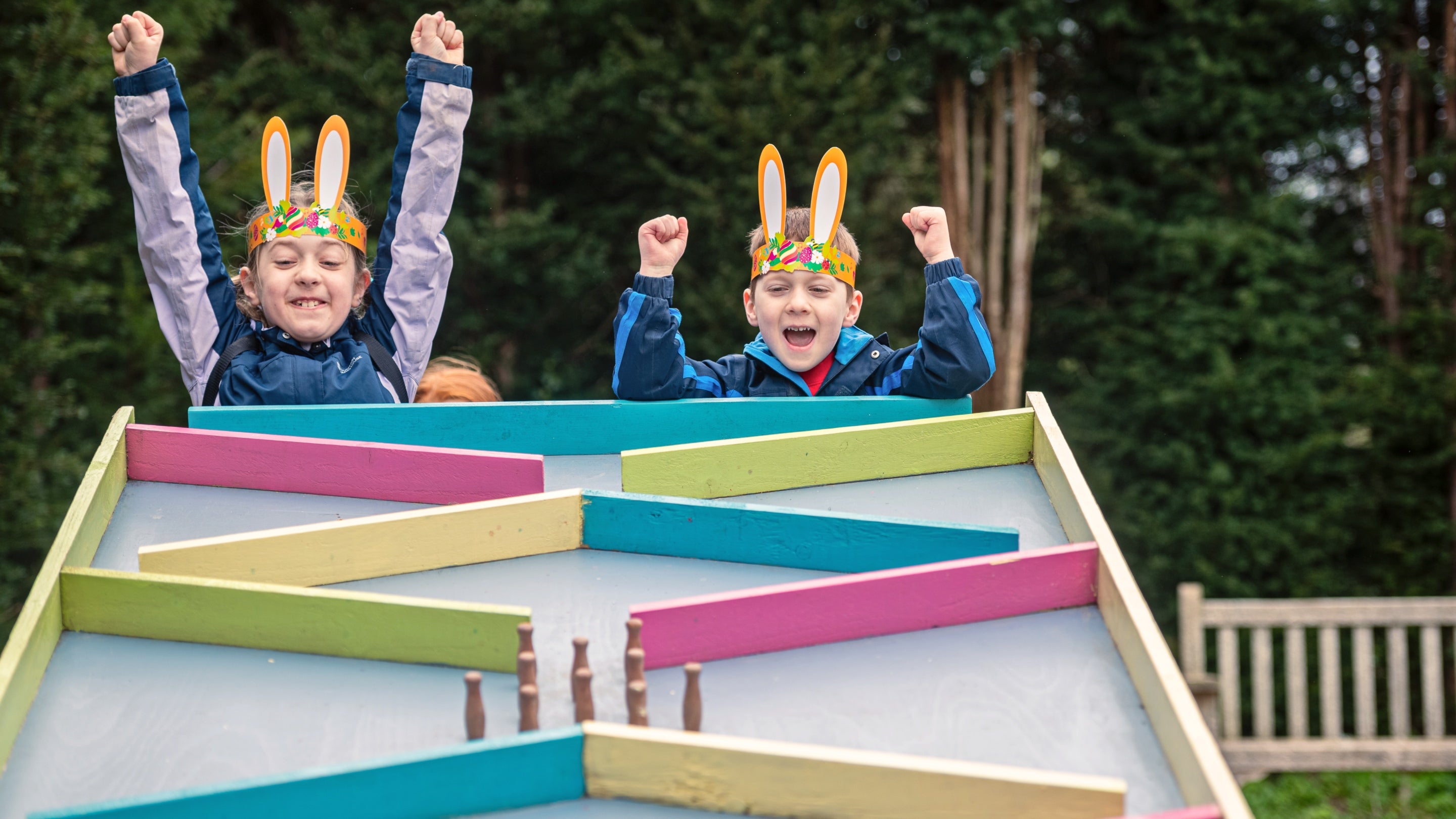 Children celebrating a win on the egg run during the Easter Adventures Trail at Dyffryn Gardens, Vale of Glamorgan
