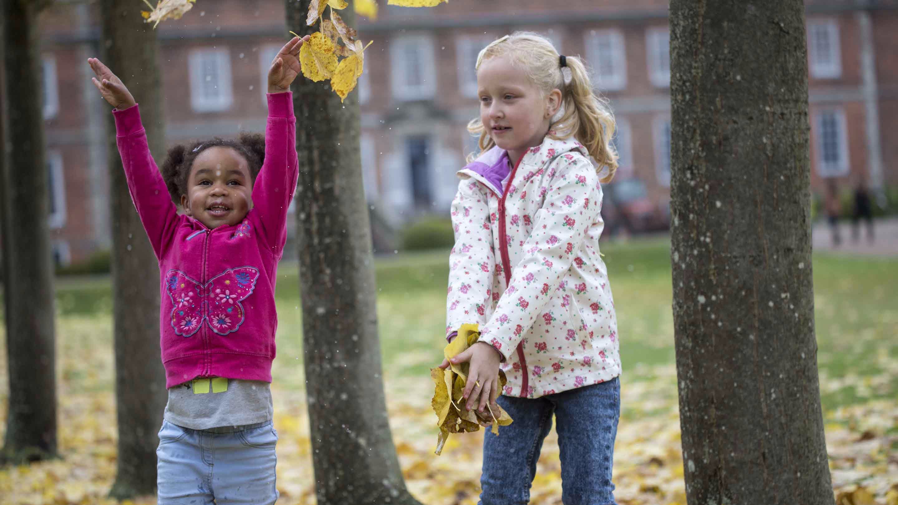 Children playing in the garden in October at Erddig, Clwyd.