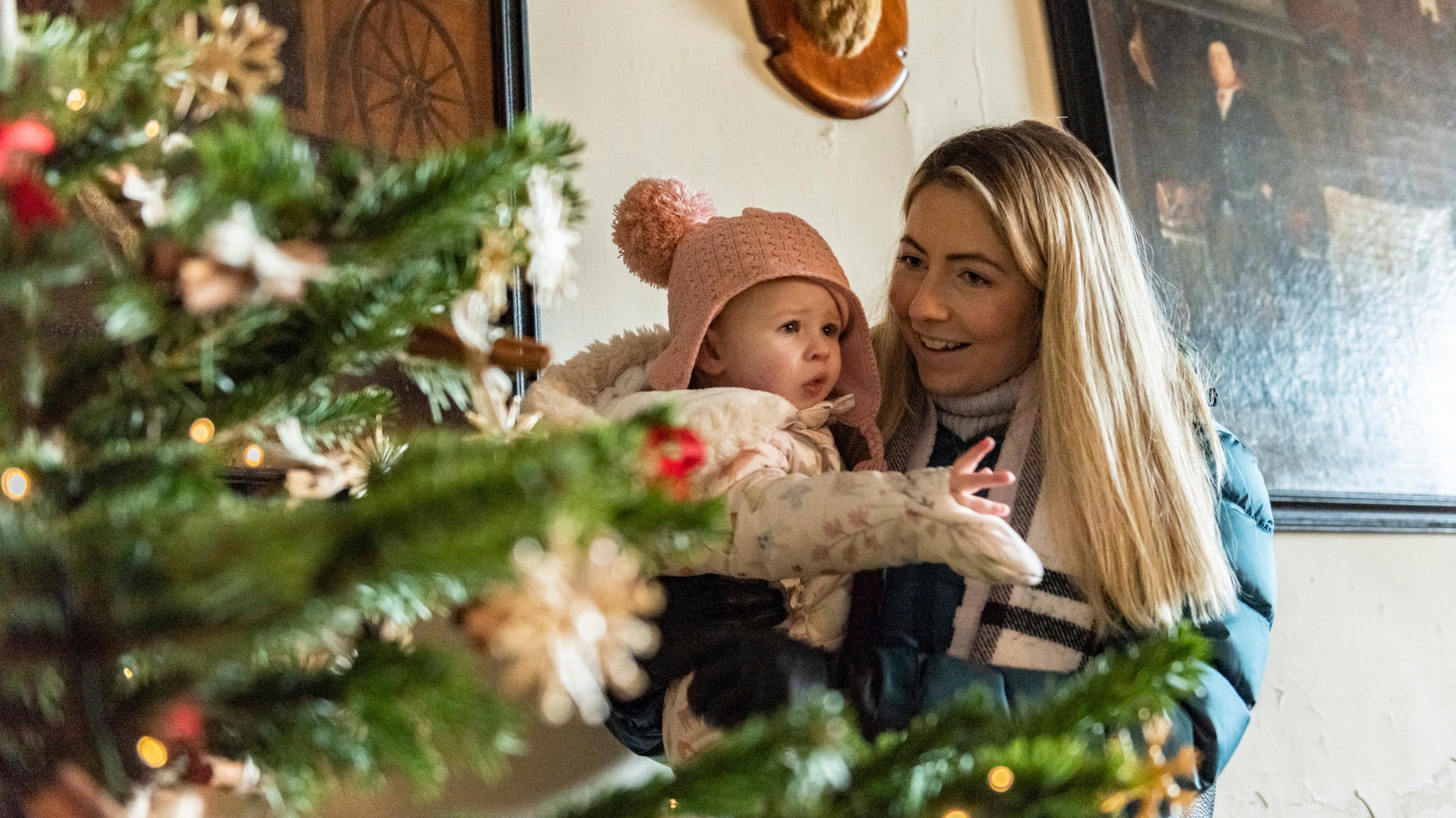 A family exploring the Christmas decorations in Erddig Hall, Wrexham