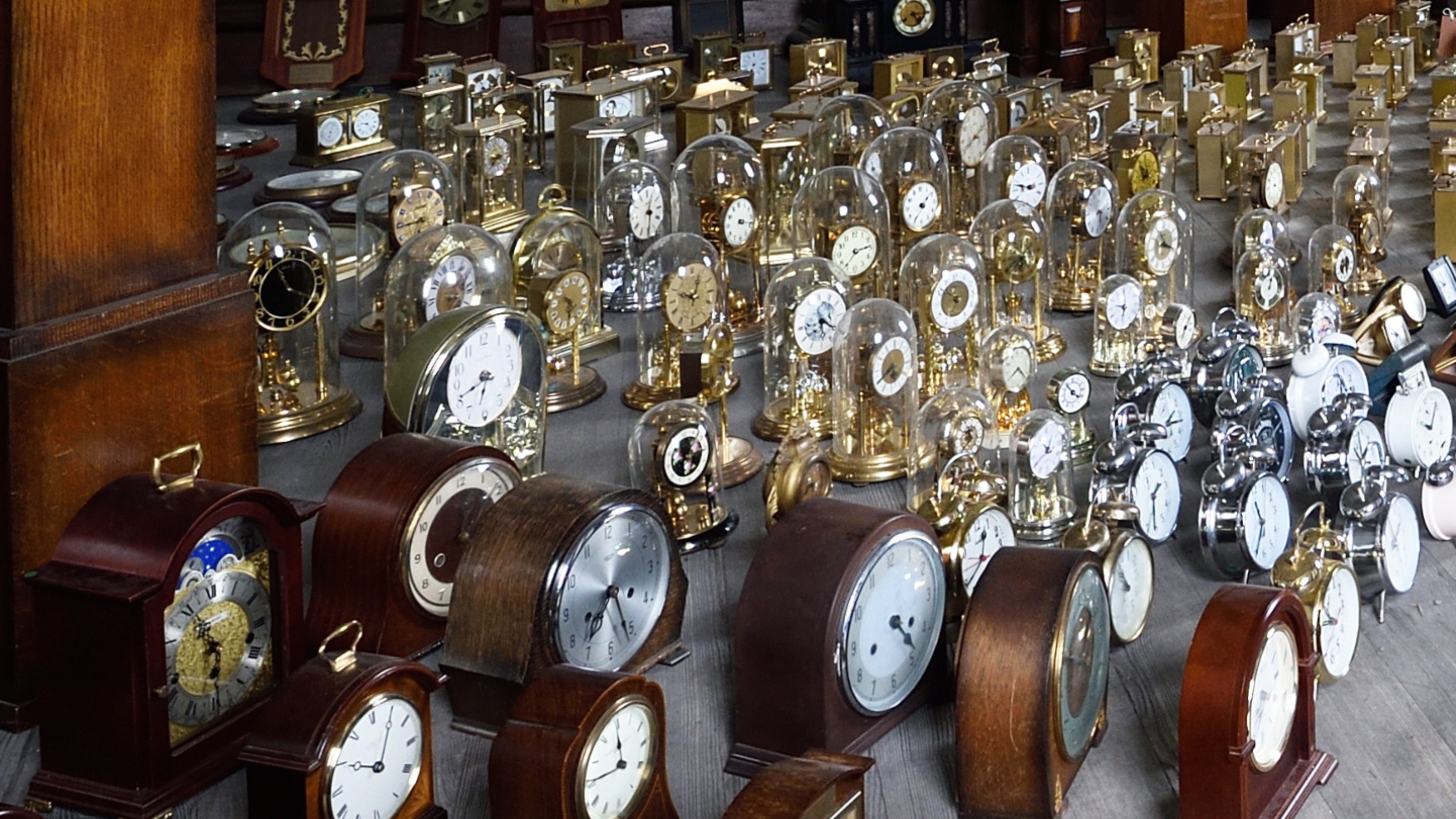 Clocks in Harrison’s Garden art installation at Penrhyn Castle, Wales
