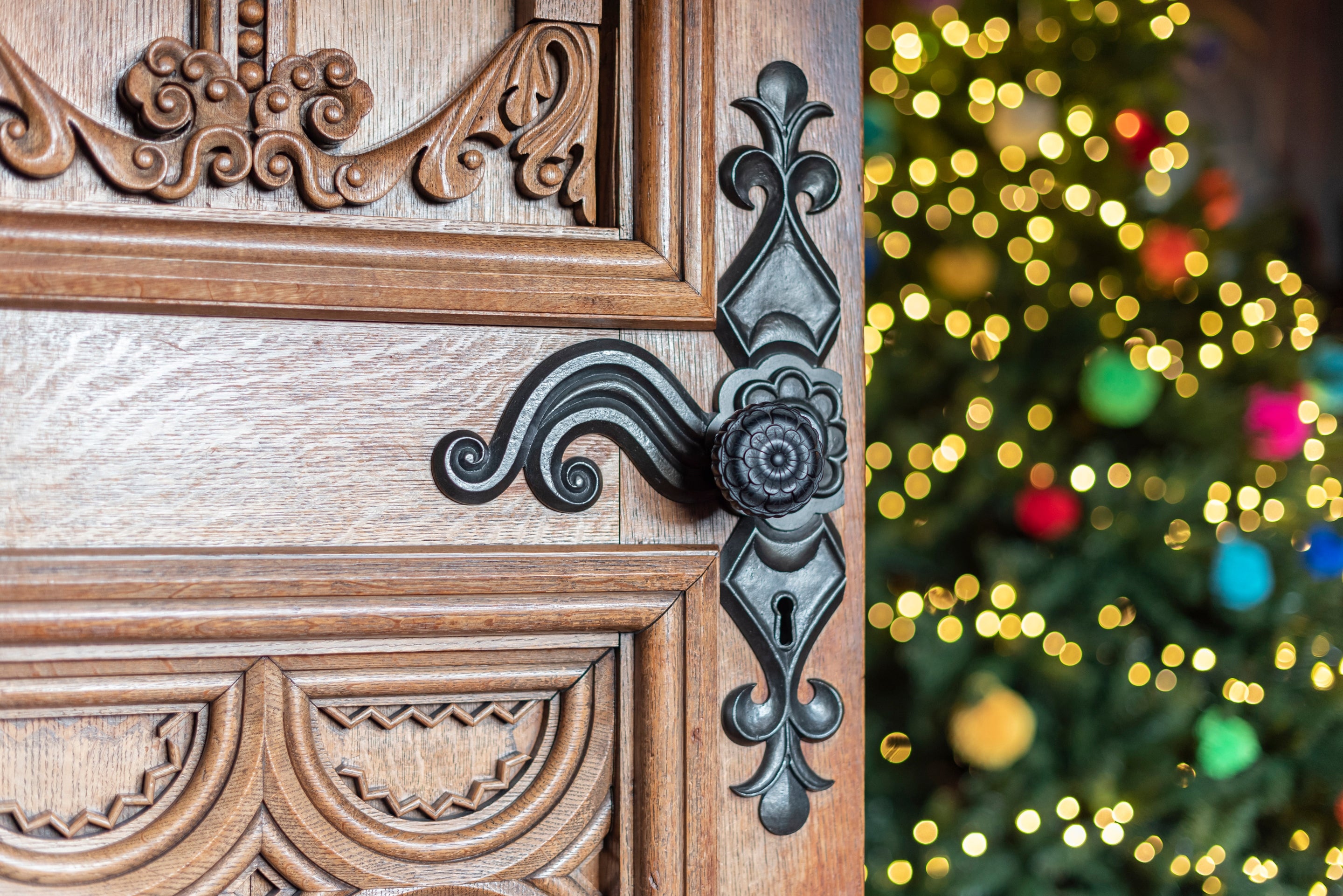 A Christmas tree can be seen behind the door at the library at Penrhyn Castle, Wales.