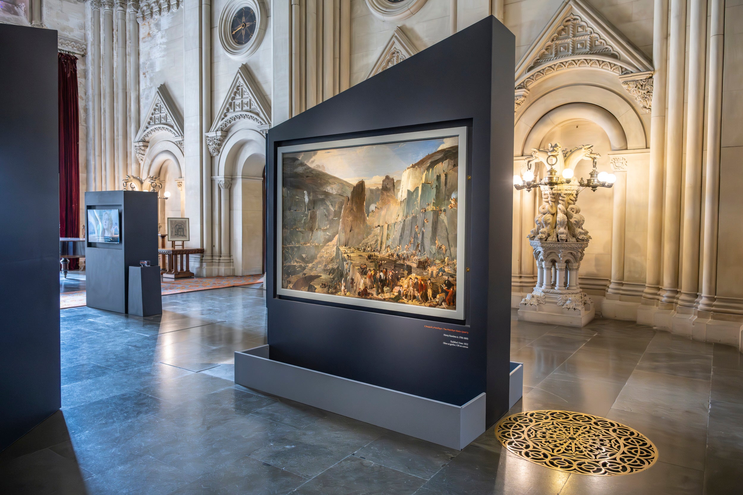 The 'Penrhyn Quarry' painting is displayed in the Grand Hall at Penrhyn Castle as part of the 'Ailfframio' exhibition