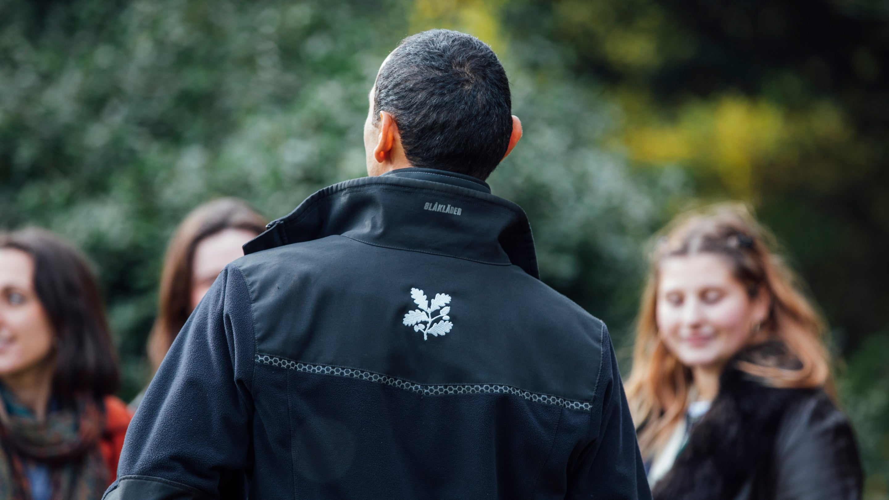 Volunteer speaking with visitors