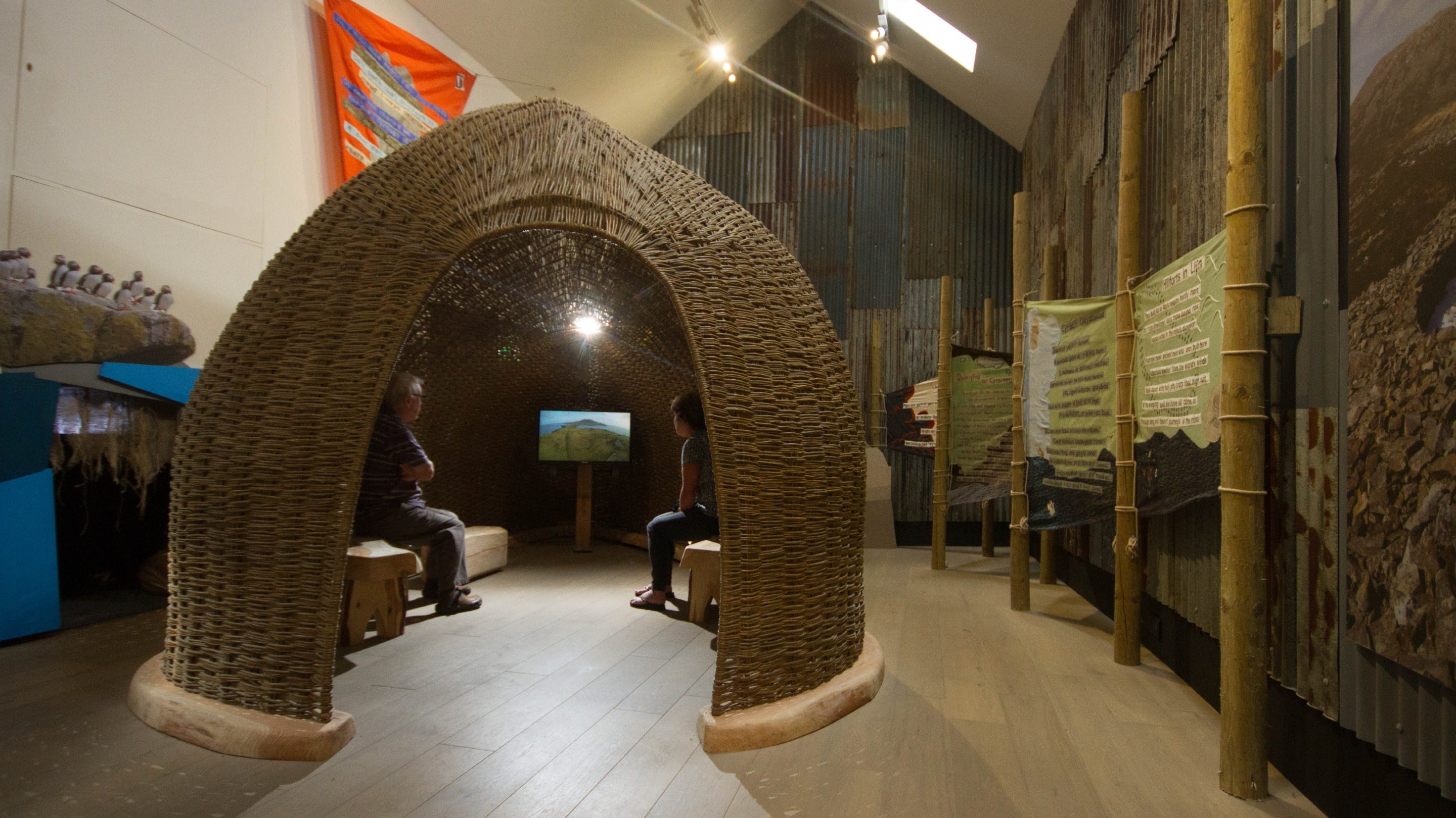 Visitors inside the video pod in 'The Way', Porth y Swnt, Wales
