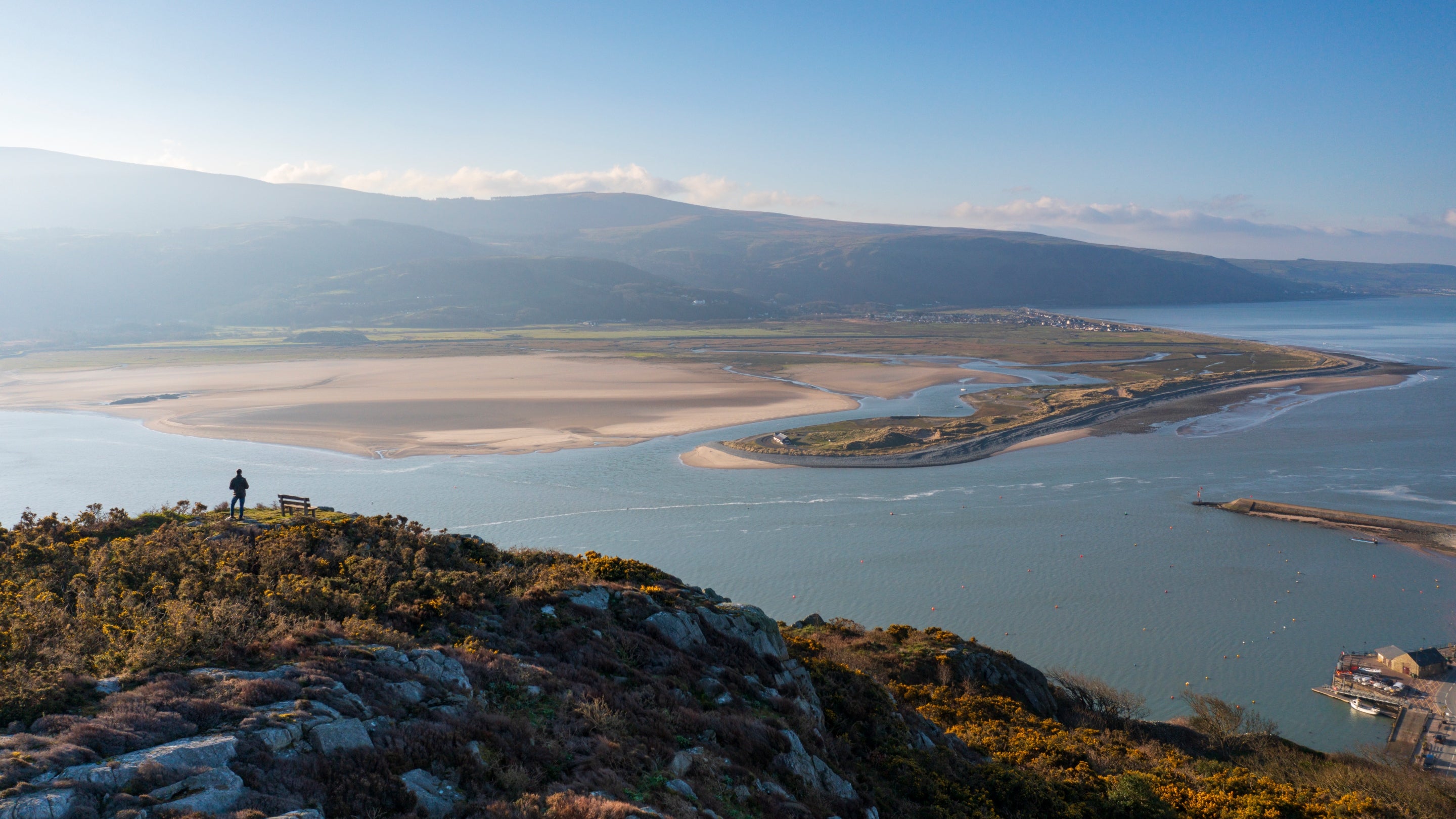 Visitor walking along the peak in Barmouth, South Snowdonia, Wales
