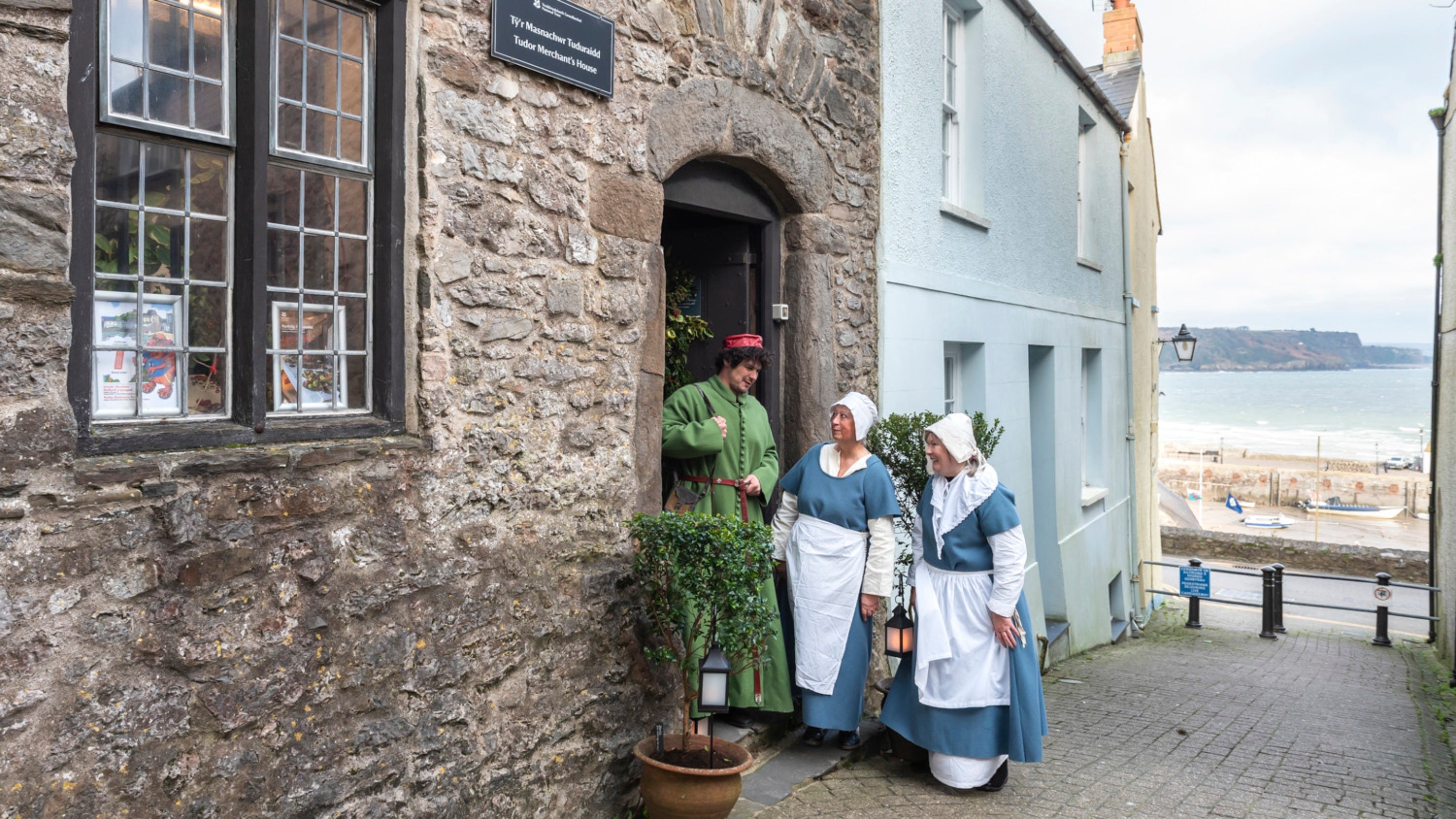 Staff dressed up outside the Tudors Tudor merchant’s House, Pembrokeshire