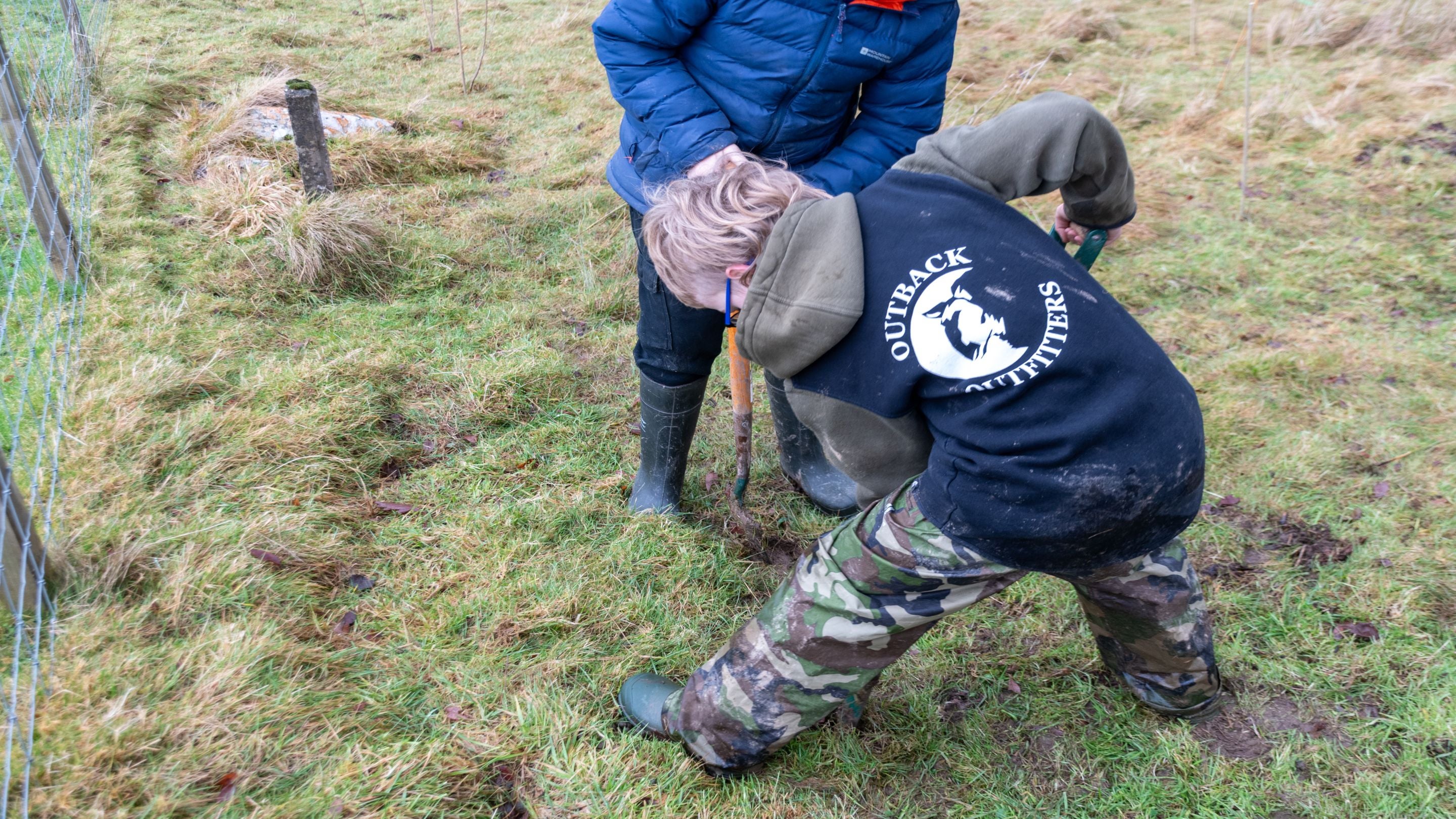 Ysgol Penmachno pupils planting trees in Penmachno