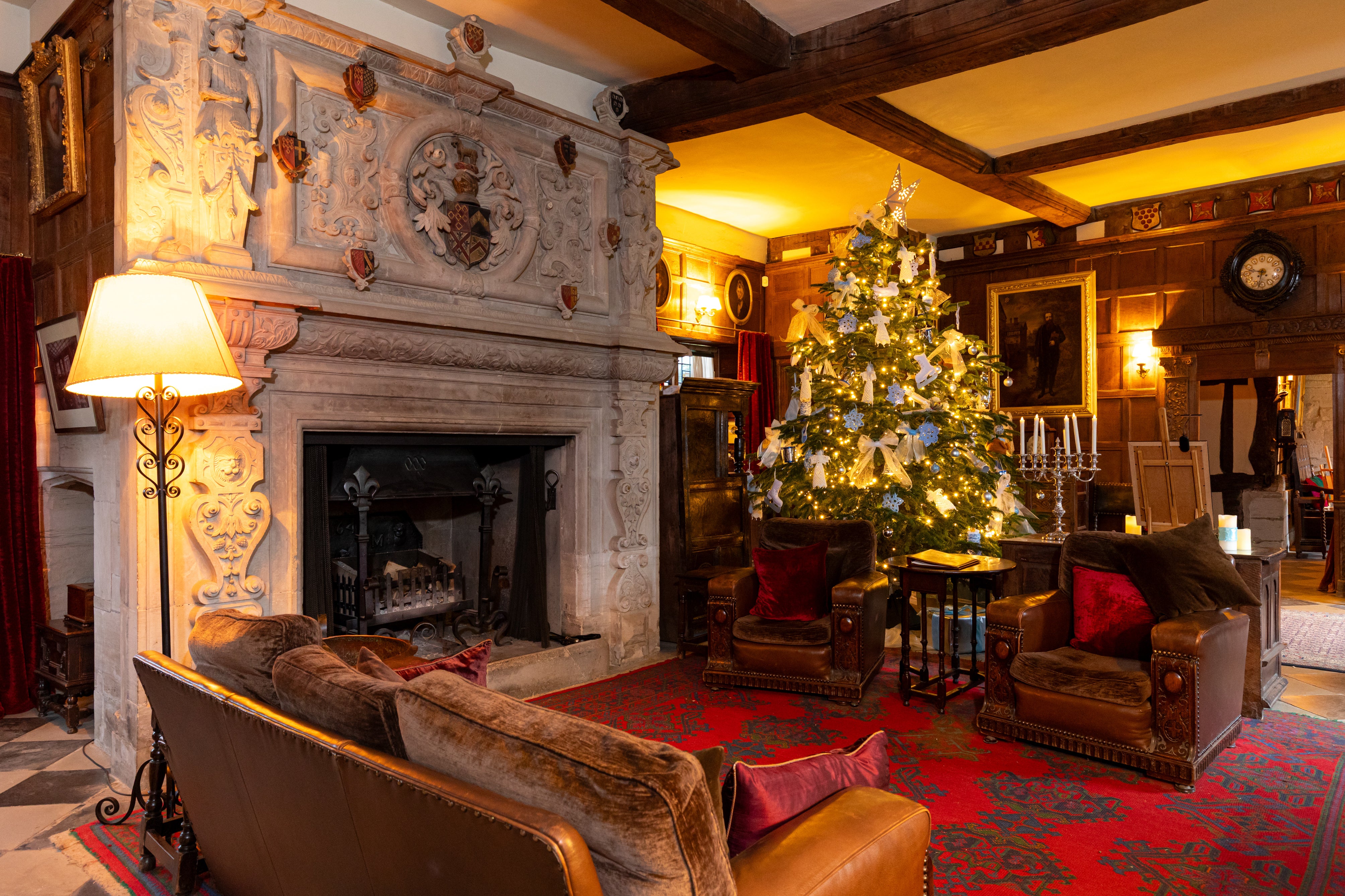 A view of the Great Hall at Baddesley Clinton, Warwickshire, with the Christmas tree in pride of place