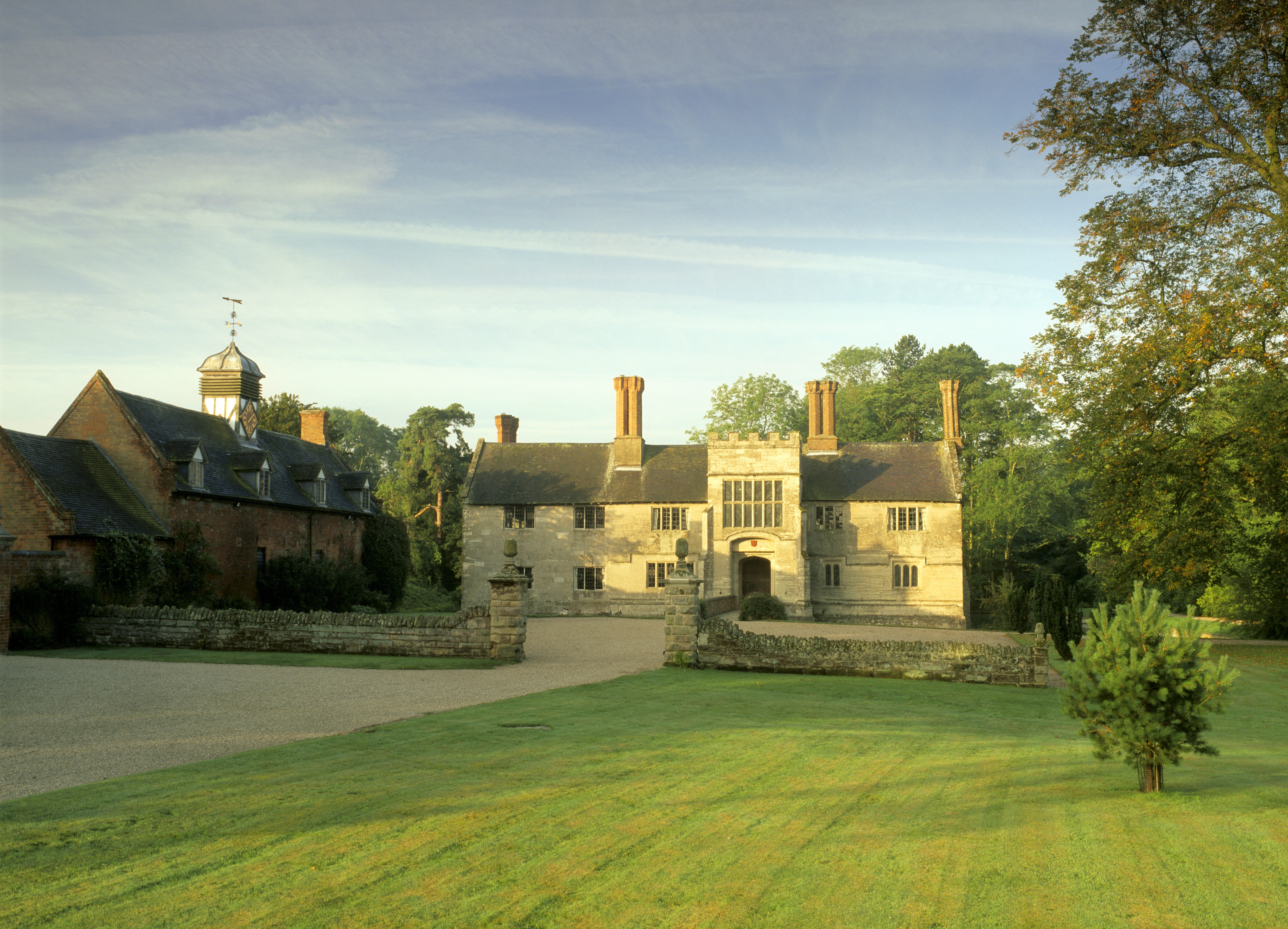 A view of the forecourt at Baddesley Clinton, Warwickshire on a summer's day