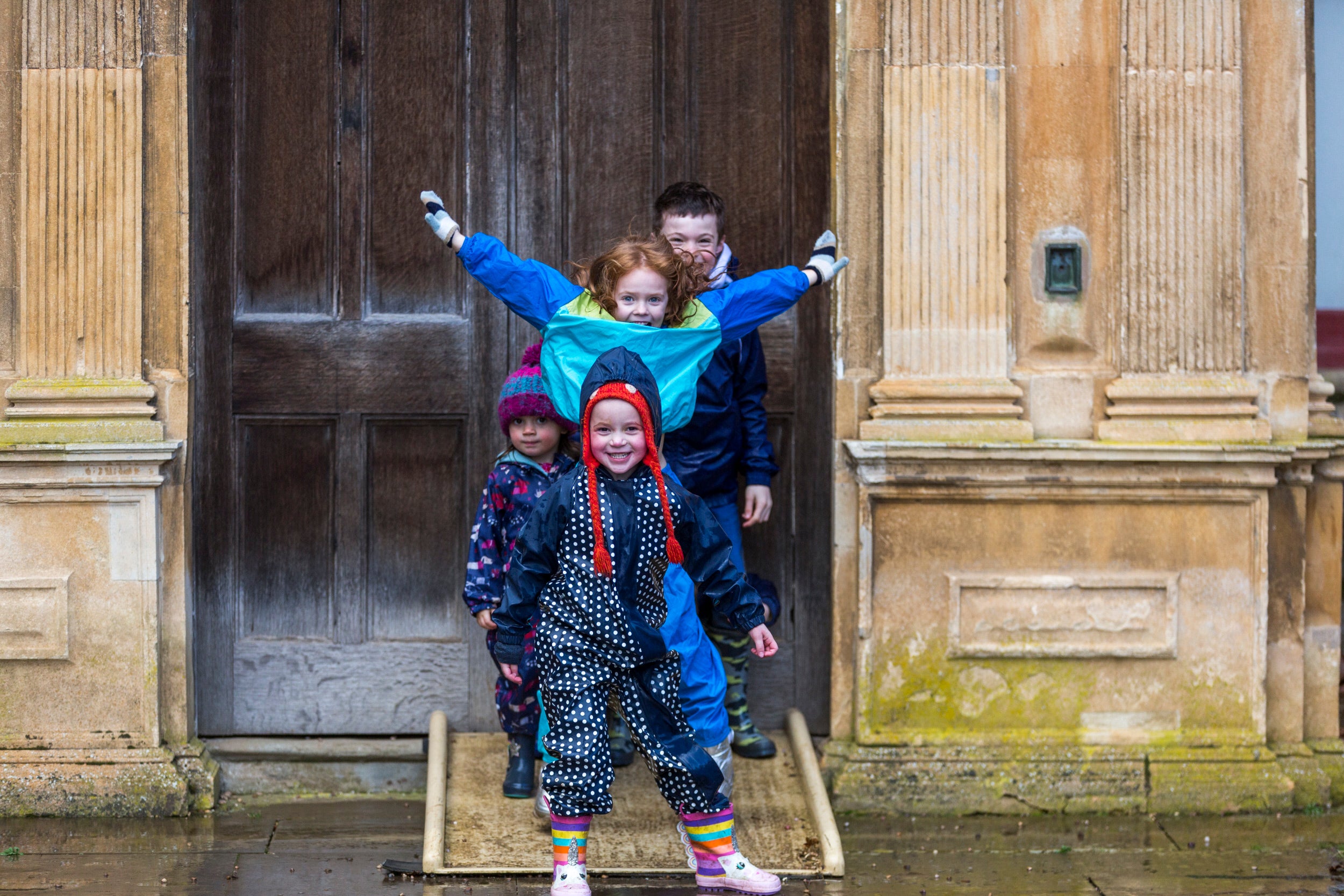 Children in front of the House at Charlecote in winter